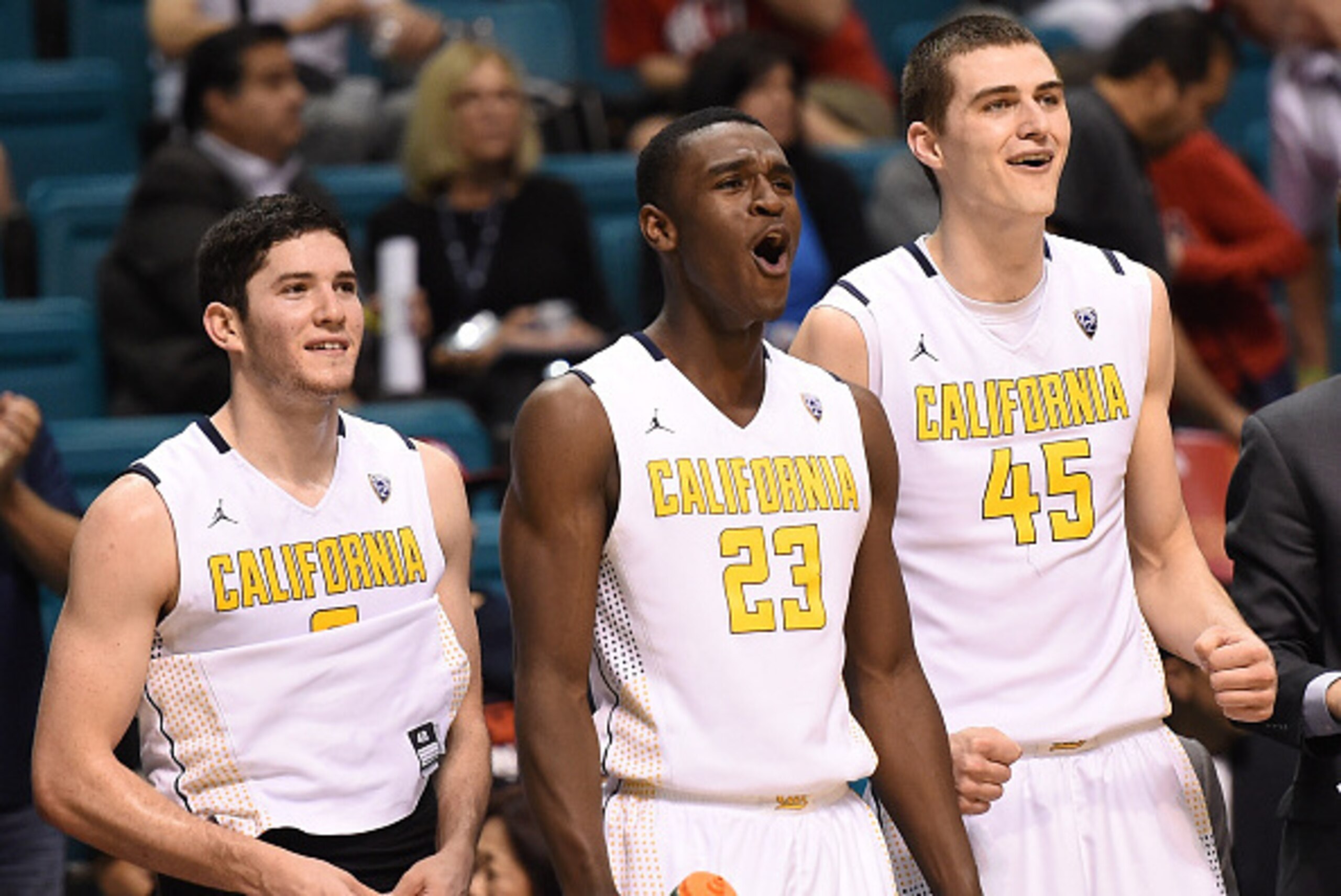 LAS VEGAS, NV - MARCH 11:  Sam Singer #2, Jabari Bird #23 and David Kravish #45 of the California Golden Bears celebrate on the bench late in their first-round game of the Pac-12 Basketball Tournament against the Washington State Cougars at the MGM Grand 