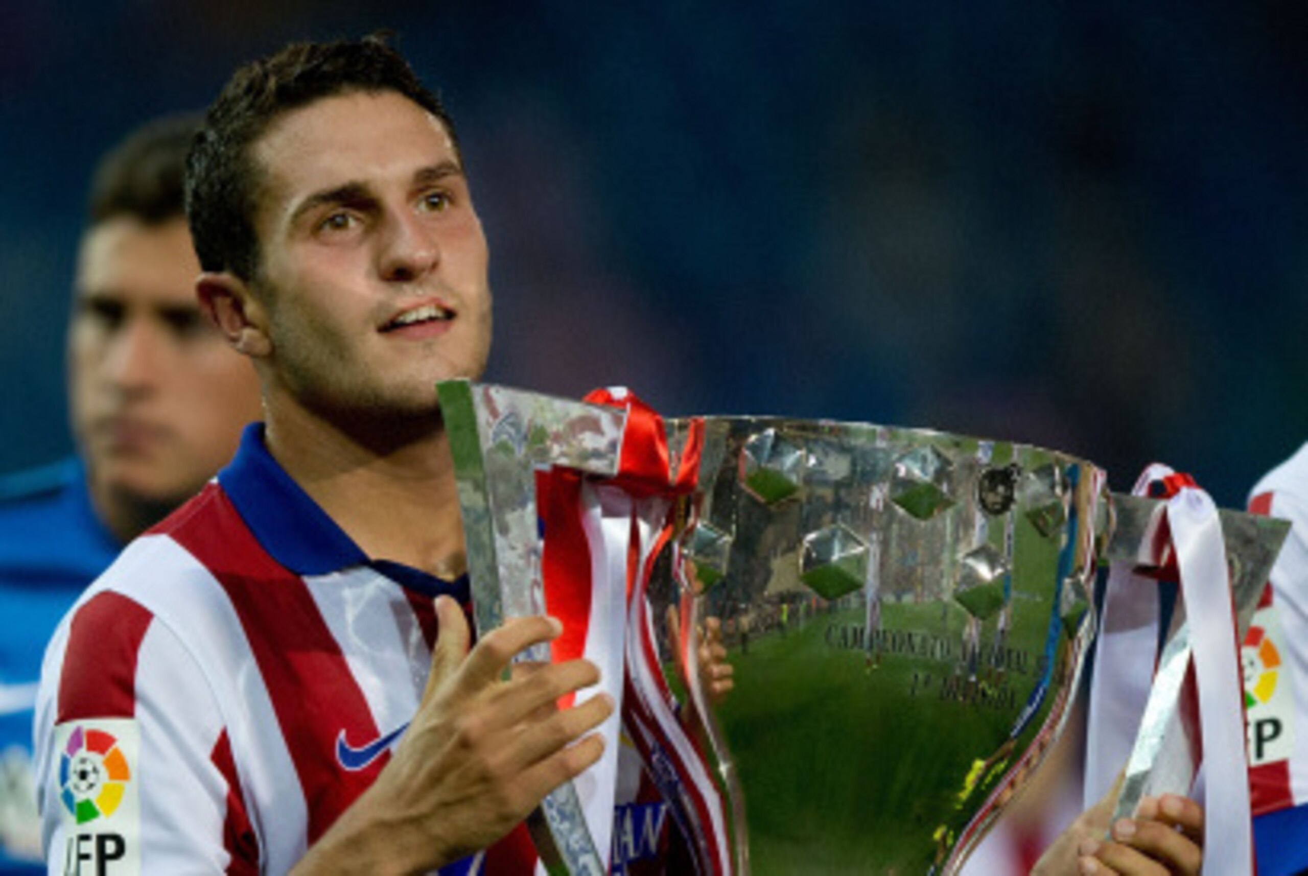 MADRID, SPAIN - AUGUST 30:  Koke of Atletico de Madrid holds the La Liga cup during the celebration held after the La Liga match between Club Atletico de Madrid and SD Eibar at Vicente Calderon Stadium on August 30, 2014 in Madrid, Spain.  (Photo by Gonza