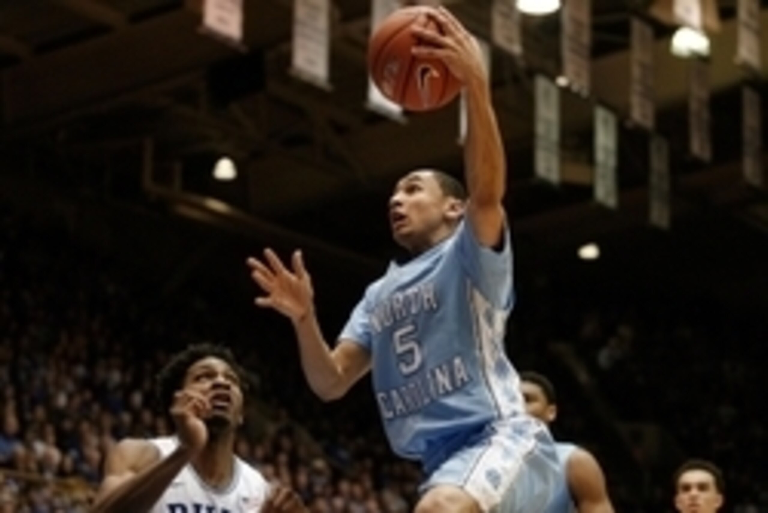 Feb 18, 2015; Durham, NC, USA; North Carolina Tar Heels guard Marcus Paige (5) drives past Duke Blue Devils forward Justise Winslow (12) in their game at Cameron Indoor Stadium. Mandatory Credit: Mark Dolejs-USA TODAY Sports