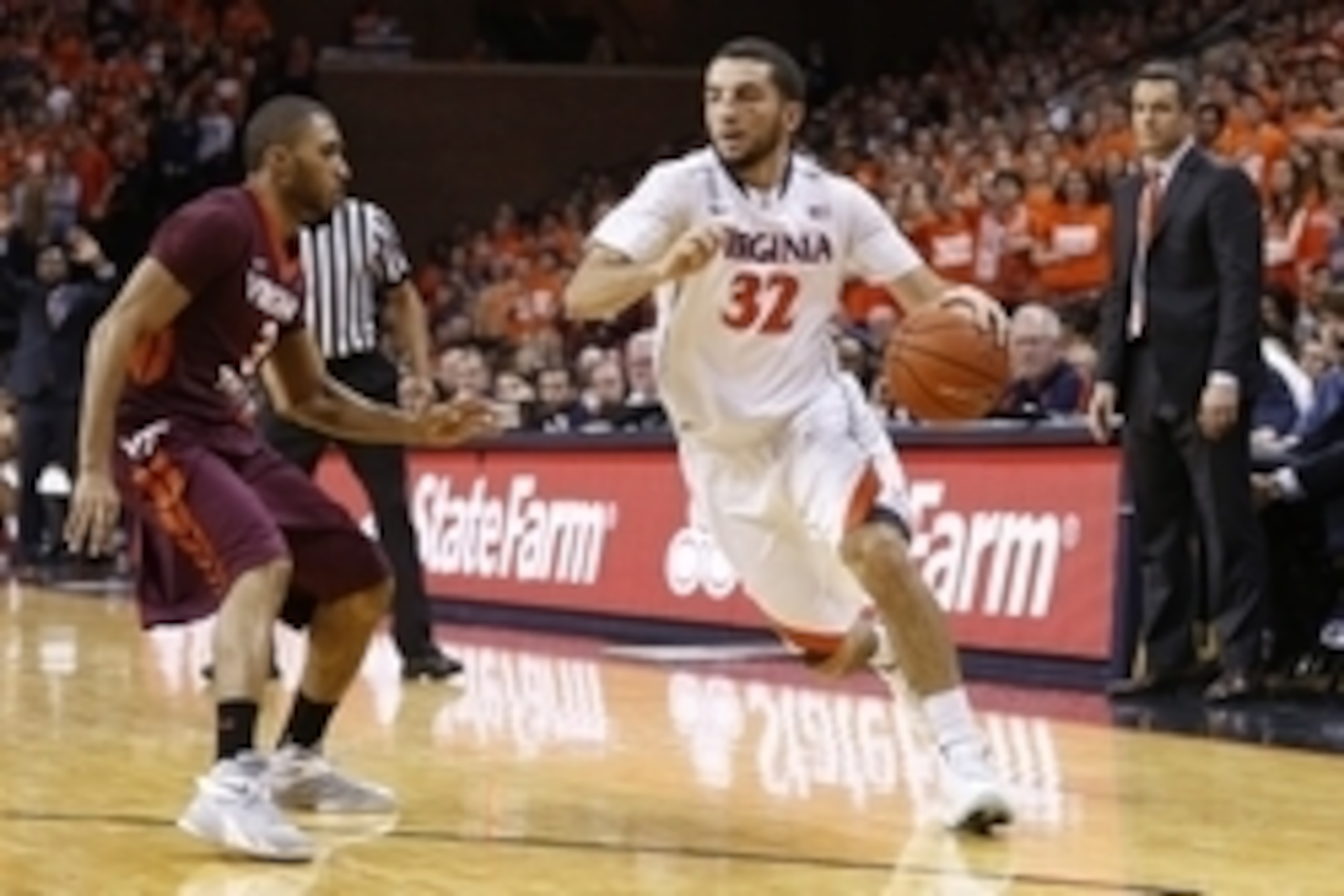 Feb 28, 2015; Charlottesville, VA, USA; Virginia Cavaliers guard London Perrantes (32) dribbles the ball as Virginia Tech Hokies guard Adam Smith (3) defends in the second half at John Paul Jones Arena. The Cavaliers won 69-57. Mandatory Credit: Geoff Bur