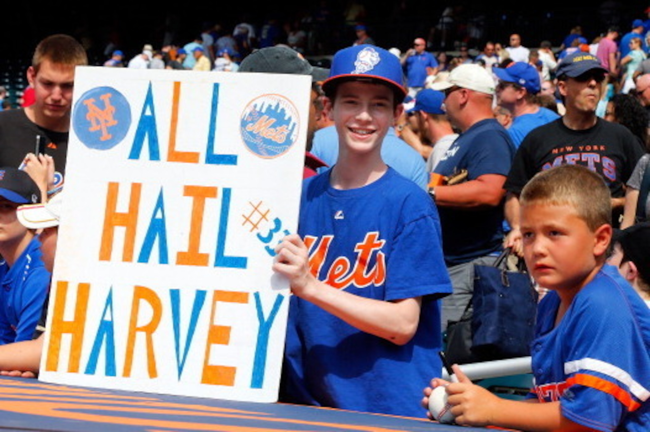 NEW YORK, NY - JULY 21:  A young fan holds a banner in reference to Matt Harvey of the New York Mets after a game against the Philadelphia Phillies at Citi Field on July 21, 2013 in the Flushing neighborhood of the Queens borough of New York City.  (Photo