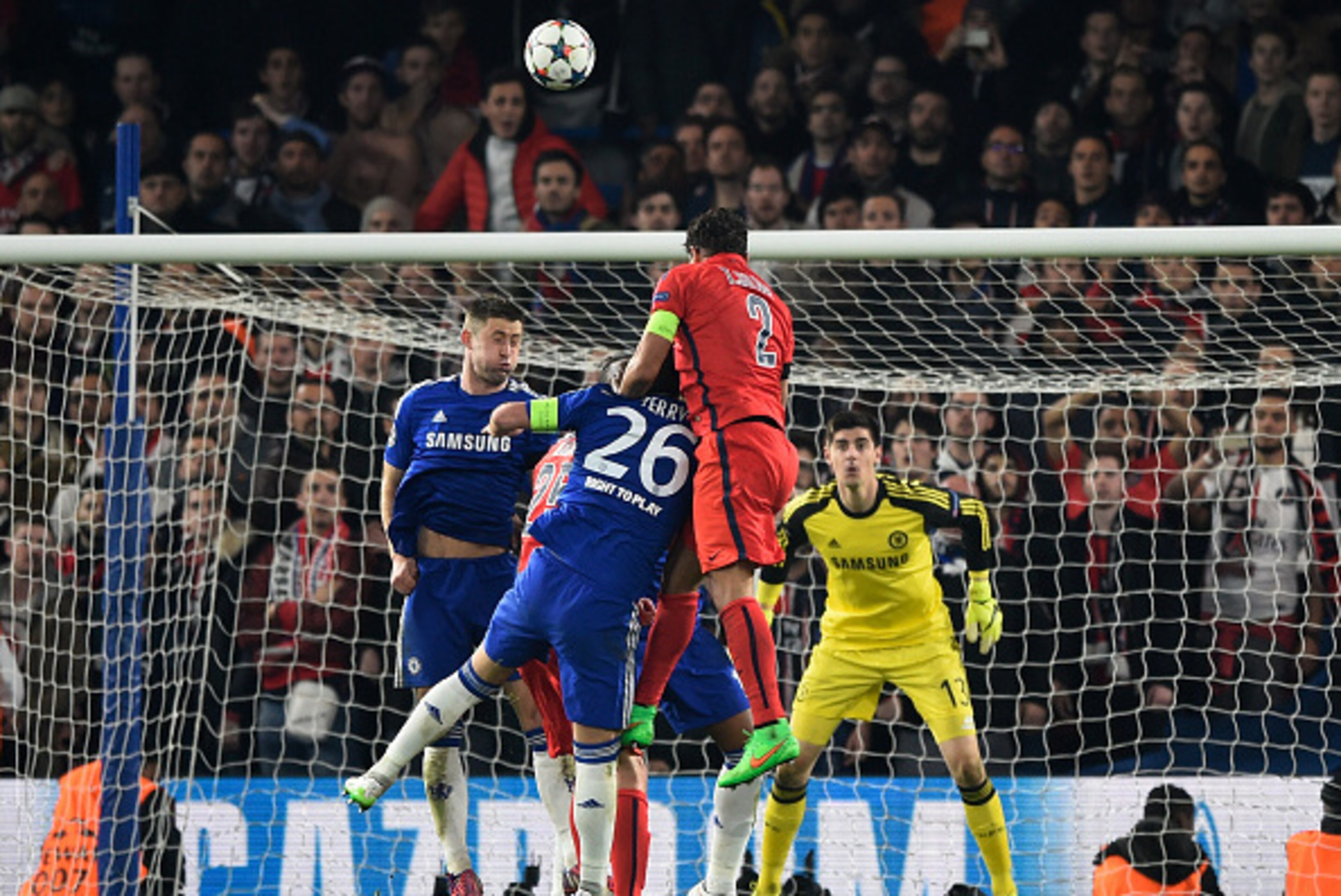 LONDON, ENGLAND - MARCH 11:  Thiago Silva #2 of PSG rises above John Terry of Chelsea to score a goal to level the scores at 2-2 during the UEFA Champions League Round of 16, second leg match between Chelsea and Paris Saint-Germain at Stamford Bridge on M