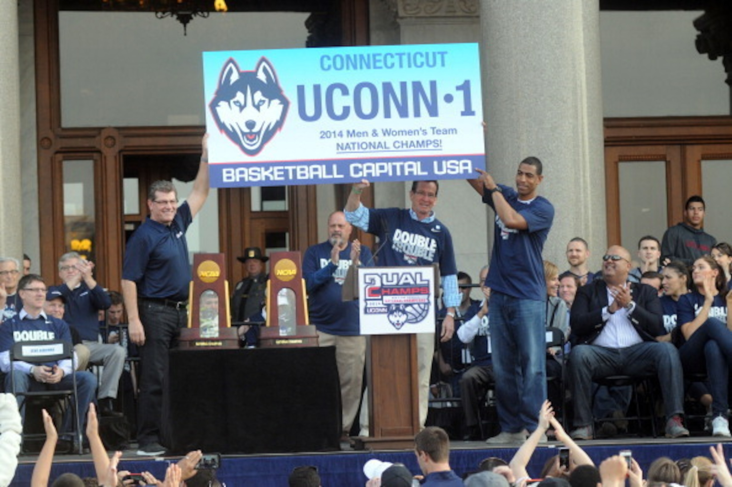 HARTFORD, CT - APRIL 13: Uconn Huskies men's head coache Kevin Ollie (R) and women's head coach Geno Auriemma attend a rally at the Connecticut State Capitol to celebrate their national championships April 13, 2014 in Hartford, Connecticut. This year was 
