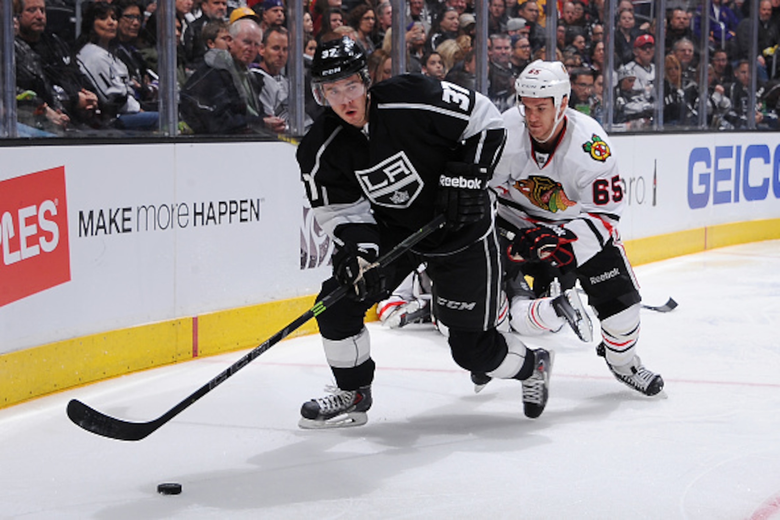 LOS ANGELES, CA - JANUARY 28: Nick Shore #37 of the Los Angeles Kings handles the puck against Andrew Shaw #65 of the Chicago Blackhawks at STAPLES Center on January 28, 2015 in Los Angeles, California. (Photo by Juan Ocampo/NHLI via Getty Images)