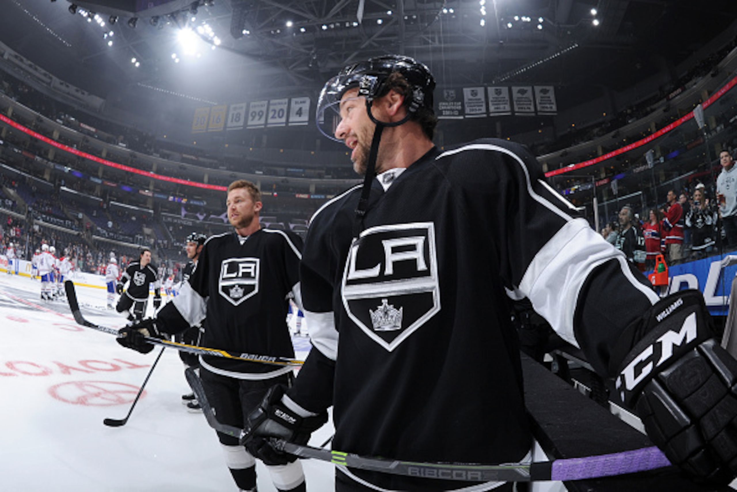 LOS ANGELES, CA - MARCH 05: Justin Williams #14 converses with Trevor Lewis #22 of the Los Angeles Kings before a game against the Montreal Canadiens at STAPLES Center on March 05, 2015 in Los Angeles, California. (Photo by Andrew D. Bernstein/NHLI via Ge