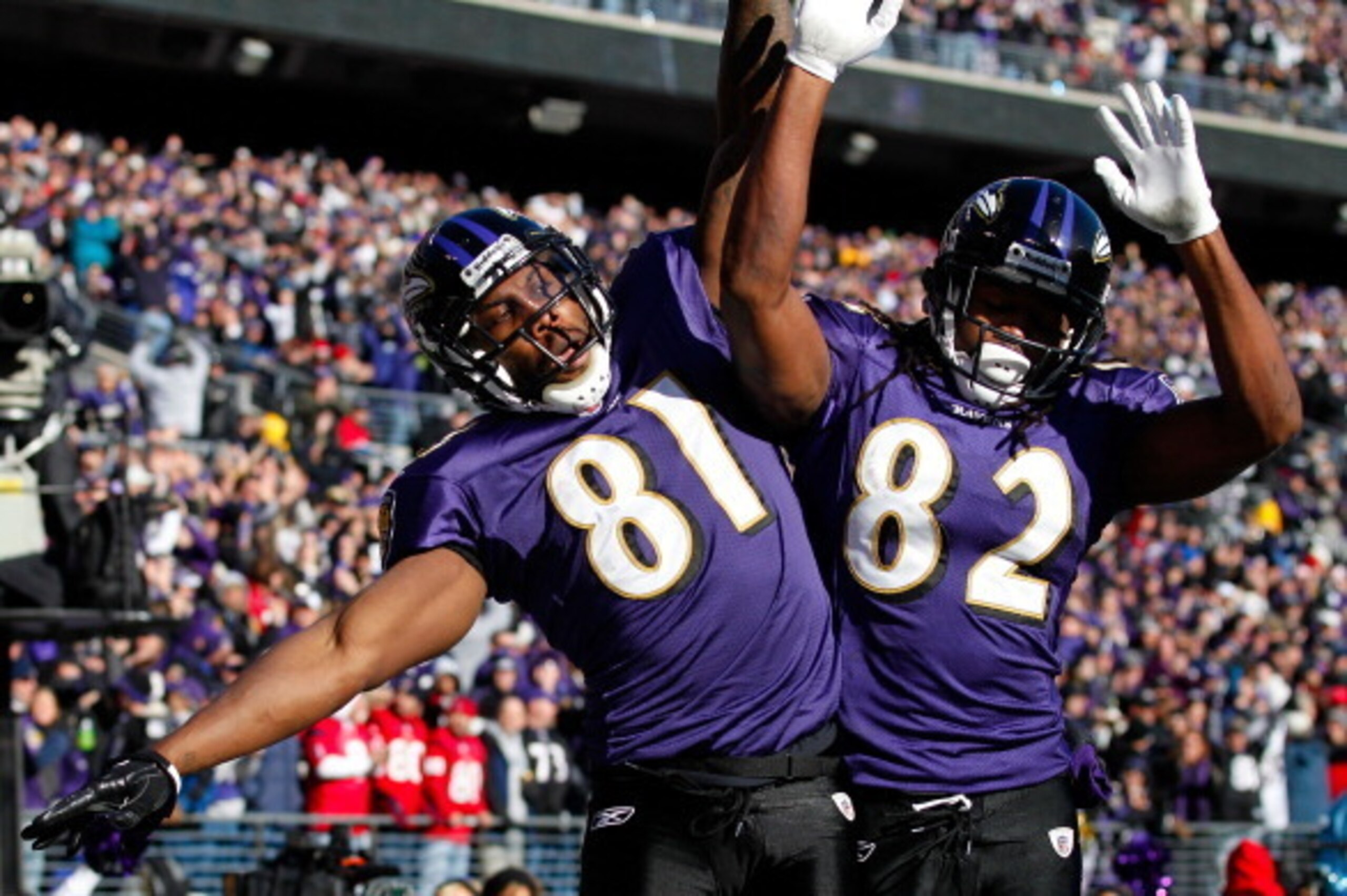 BALTIMORE, MD - JANUARY 15:  Anquan Boldin #81 of the Baltimore Ravens celebrates scoring a touchdown with teammate Torrey Smith #82 against the Houston Texans during the first quarter of the AFC Divisional playoff game at M&T Bank Stadium on January 15, 