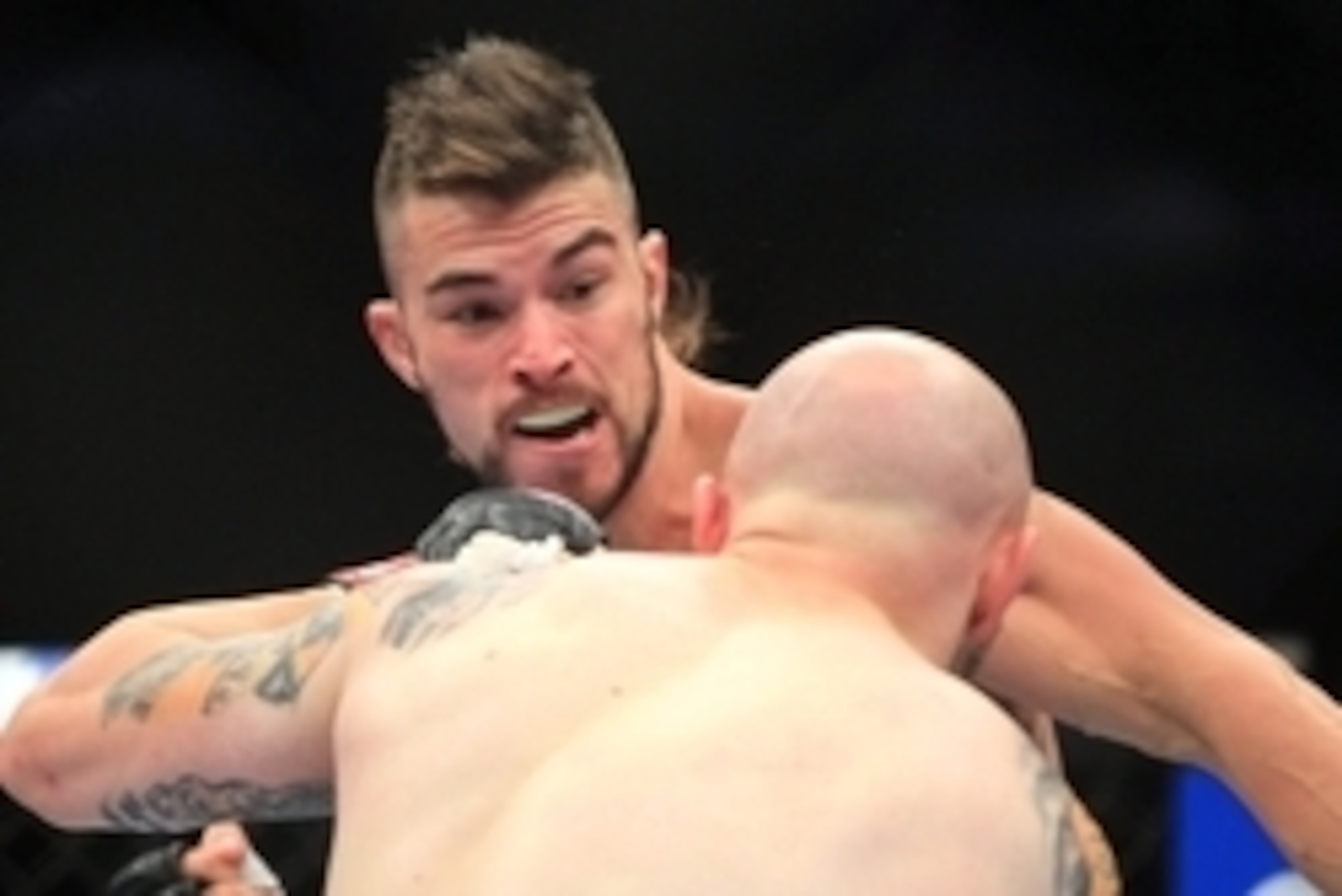 Aug 27, 2013; Indianapolis, IN, USA; Justin Edwards (front) fights Brandon Thatch during UFC Fight Night 27 at Bankers Life Fieldhouse. Mandatory Credit: Pat Lovell-USA TODAY Sports