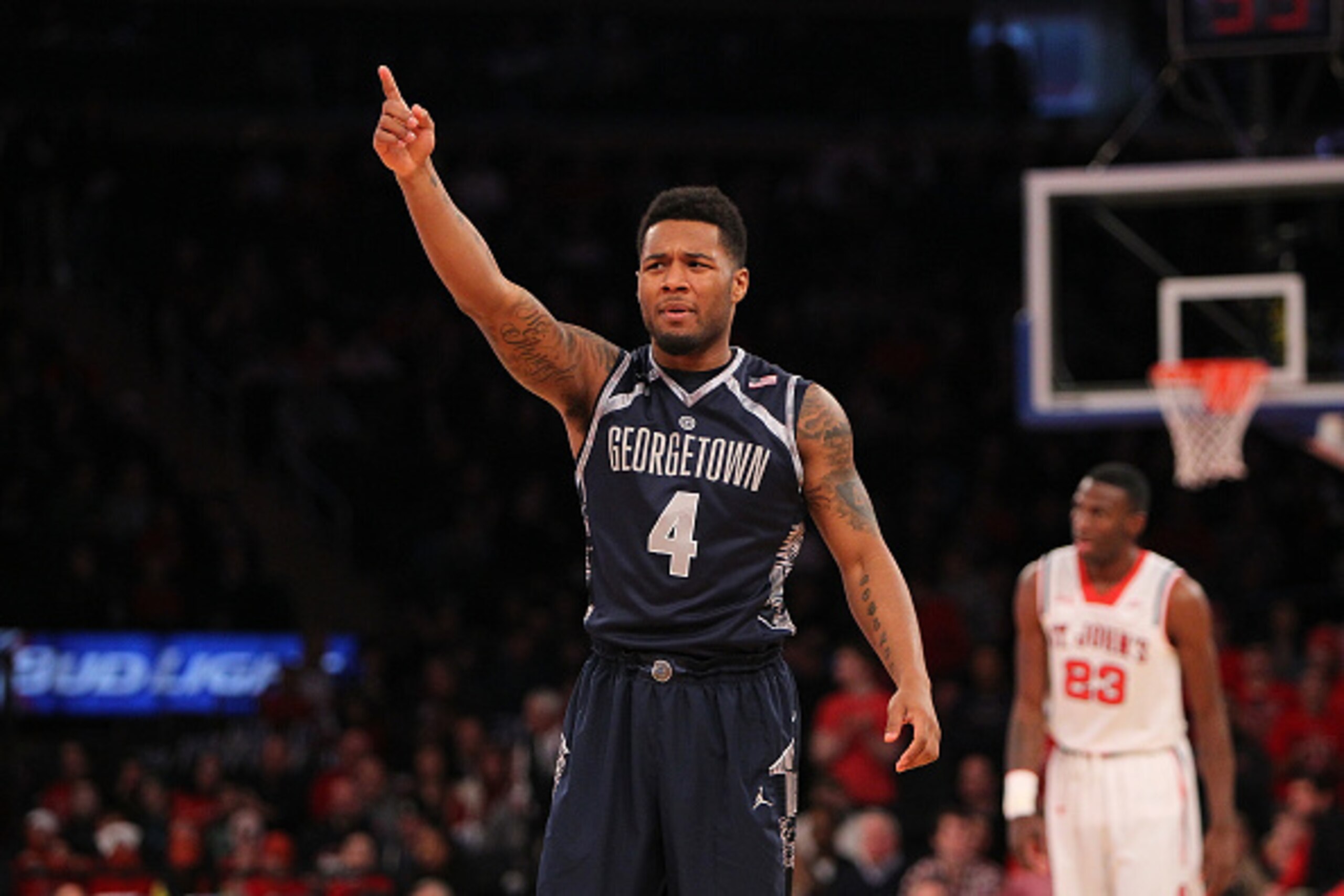 NEW YORK, NY - FEBRUARY 28:  D'Vauntes Smith-Rivera #4 of the Georgetown Hoyas points as he reacts to a play while standing on the court during the game against the St. John's Red Storm at Madison Square Garden on February 28, 2015 in New York City. (Phot