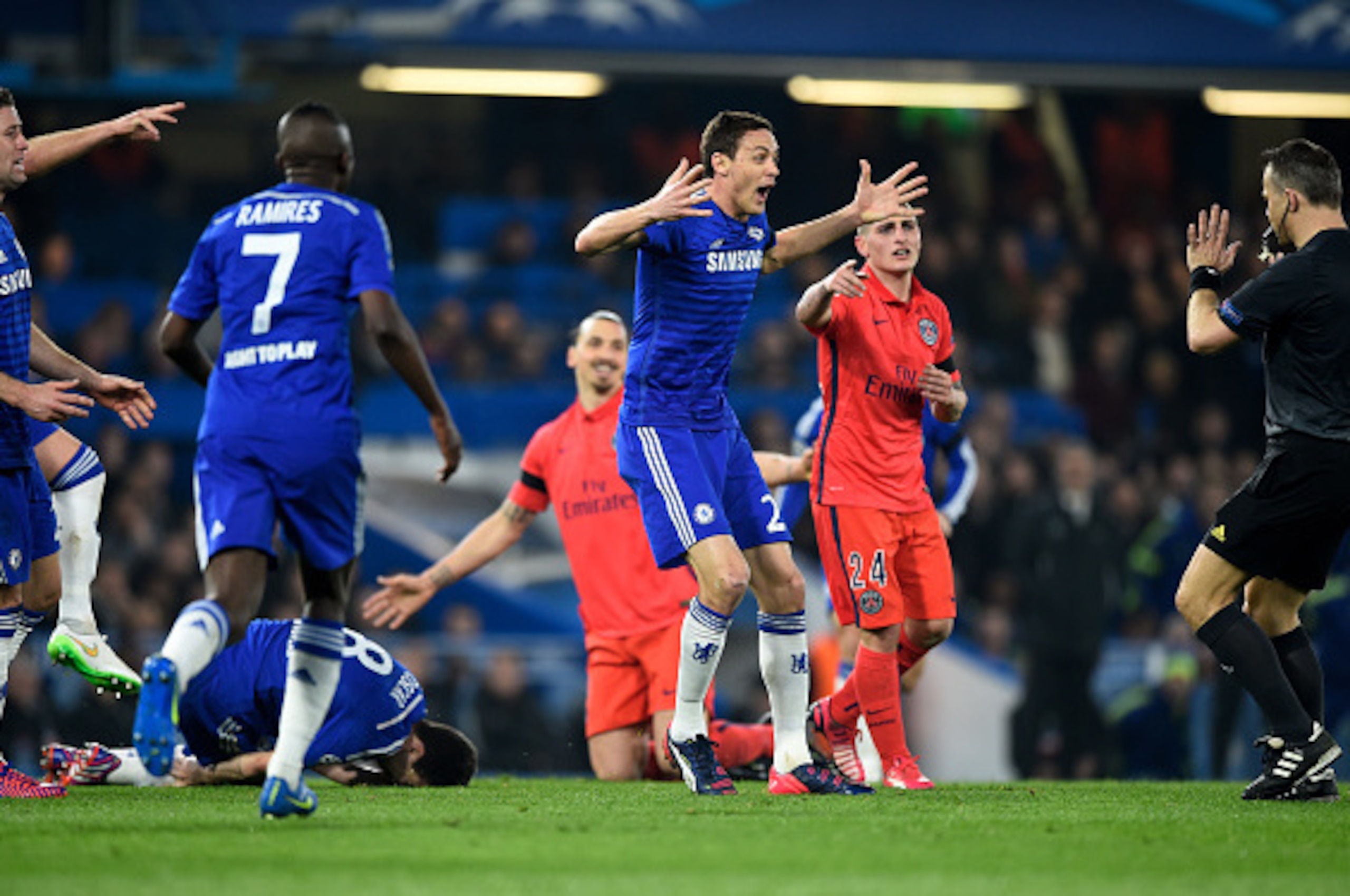 LONDON, ENGLAND - MARCH 11:  Nemanja Matic of Chelsea appeals to referee Bjorn Kuipers of the Netherlands following a bad tackle on teammate Oscar of Chelsea by Zlatan Ibrahimovic of PSG during the UEFA Champions League Round of 16, second leg match betwe