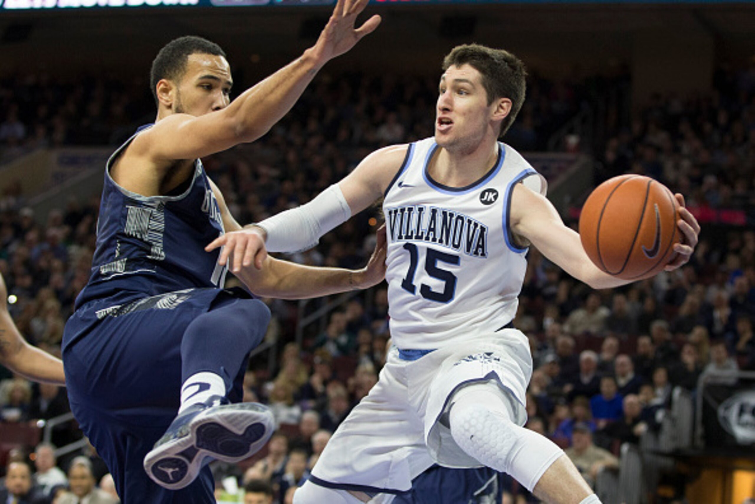 PHILADELPHIA, PA - FEBRUARY 7: Ryan Arcidiacono #15 of the Villanova Wildcats looks to pass the ball with Isaac Copeland #11 of the Georgetown Hoyas defending on February 7, 2015 at the Wells Fargo Center in Philadelphia, Pennsylvania. The Wildcats defeat