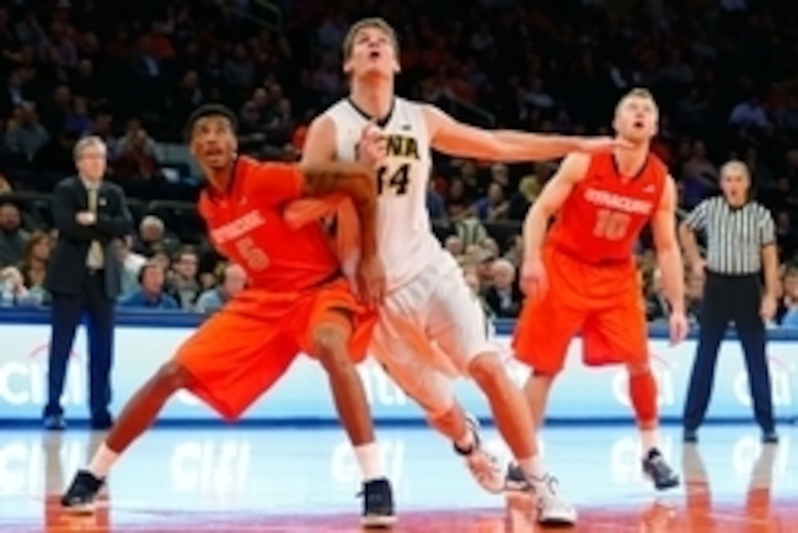 Nov 21, 2014; New  York, NY, USA;  Syracuse Orange forward Chris McCullough (5) and Iowa Hawkeyes center Adam Woodbury (34) battle for position at Madison Square Garden. Syracuse Orange defeat the Iowa Hawkeyes 66-63. Mandatory Credit: Jim O'Connor-USA TO