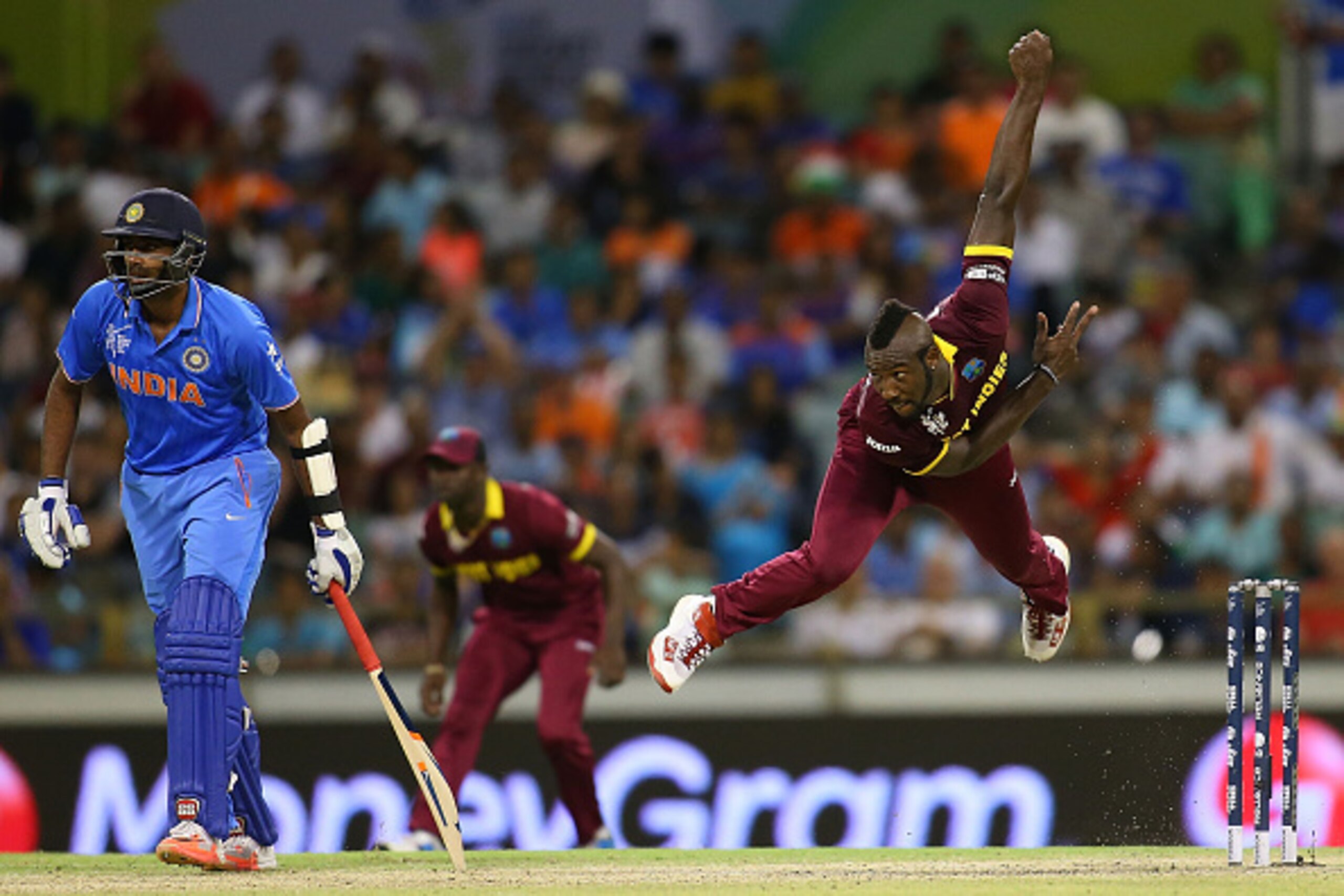 PERTH, AUSTRALIA - MARCH 06: Andre Russell of the West Indies bowls during the 2015 ICC Cricket World Cup match between India and the West Indies at WACA on March 6, 2015 in Perth, Australia.  (Photo by Paul Kane/Getty Images)