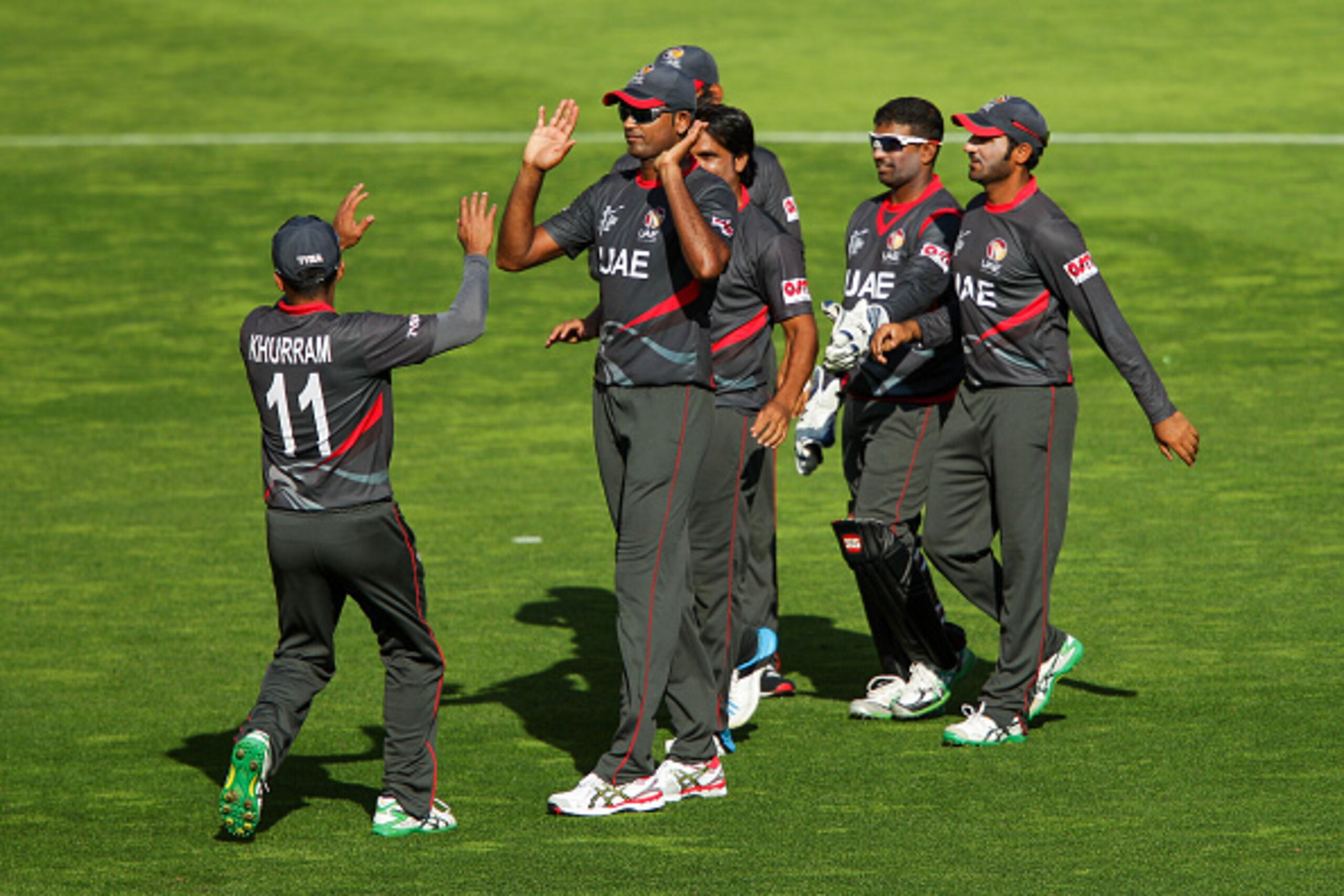 WELLINGTON, NEW ZEALAND - MARCH 12:  Khurram Khan and Amjad Javed of the United Arab Emirates celebrate the wicket of AB de Villiers of South Africa during the 2015 ICC Cricket World Cup match between South Africa and the United Arab Emirates at Wellingto
