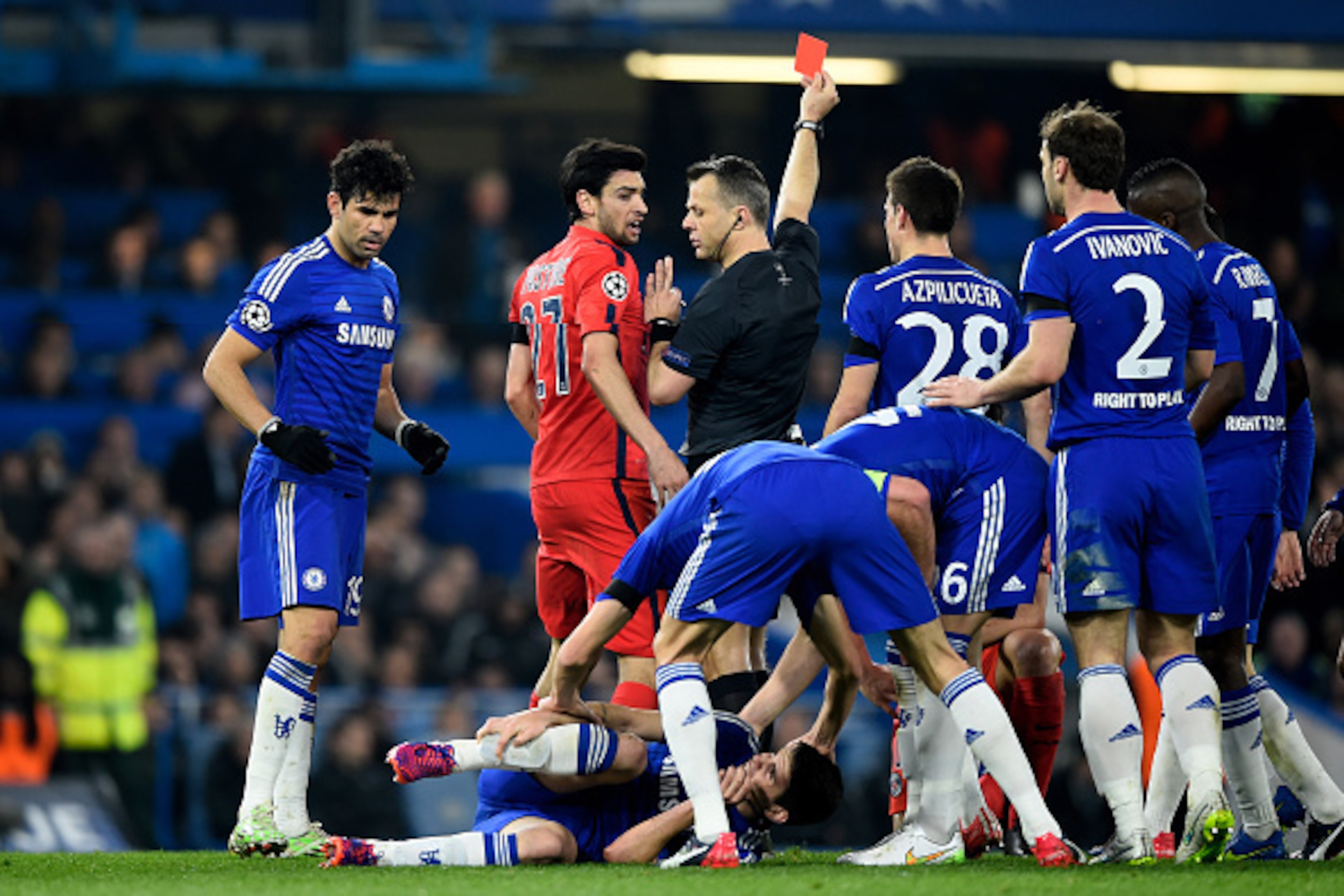 LONDON, ENGLAND - MARCH 11:  Referee Bjorn Kuipers of the Netherlands shows a straight red card to Zlatan Ibrahimovic (not seen) of PSG for his tackle on Oscar of Chelsea during the UEFA Champions League Round of 16, second leg match between Chelsea and P