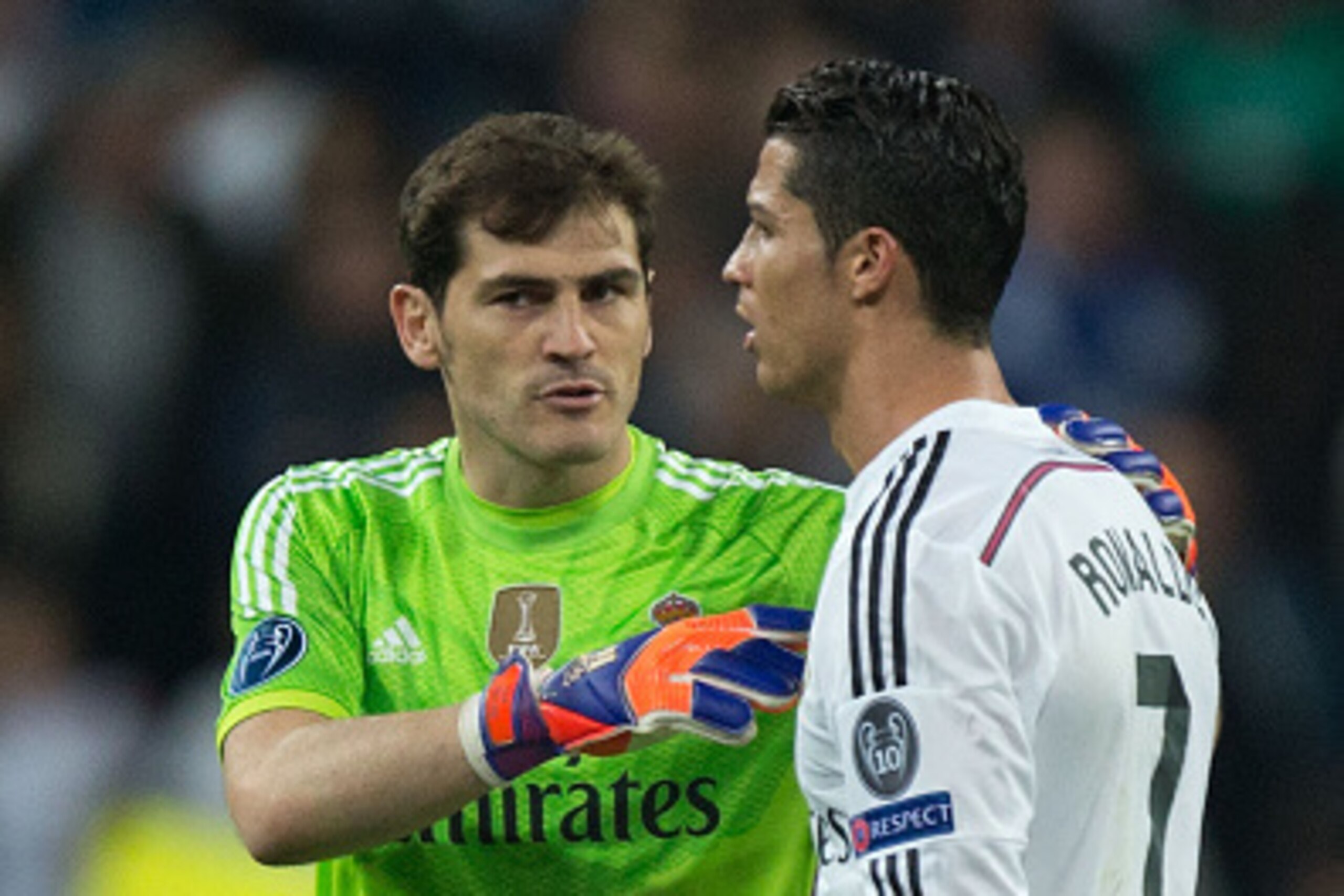 MADRID, SPAIN - MARCH 10: goalkeeper Iker Casillas (L) of Real Madrid CF holds his teammate Cristiano Ronaldo (R) after loosing the UEFA Champions League round of 16 second leg match between Real Madrid CF and FC Schalke 04 at Estadio Santiago Bernabeu on