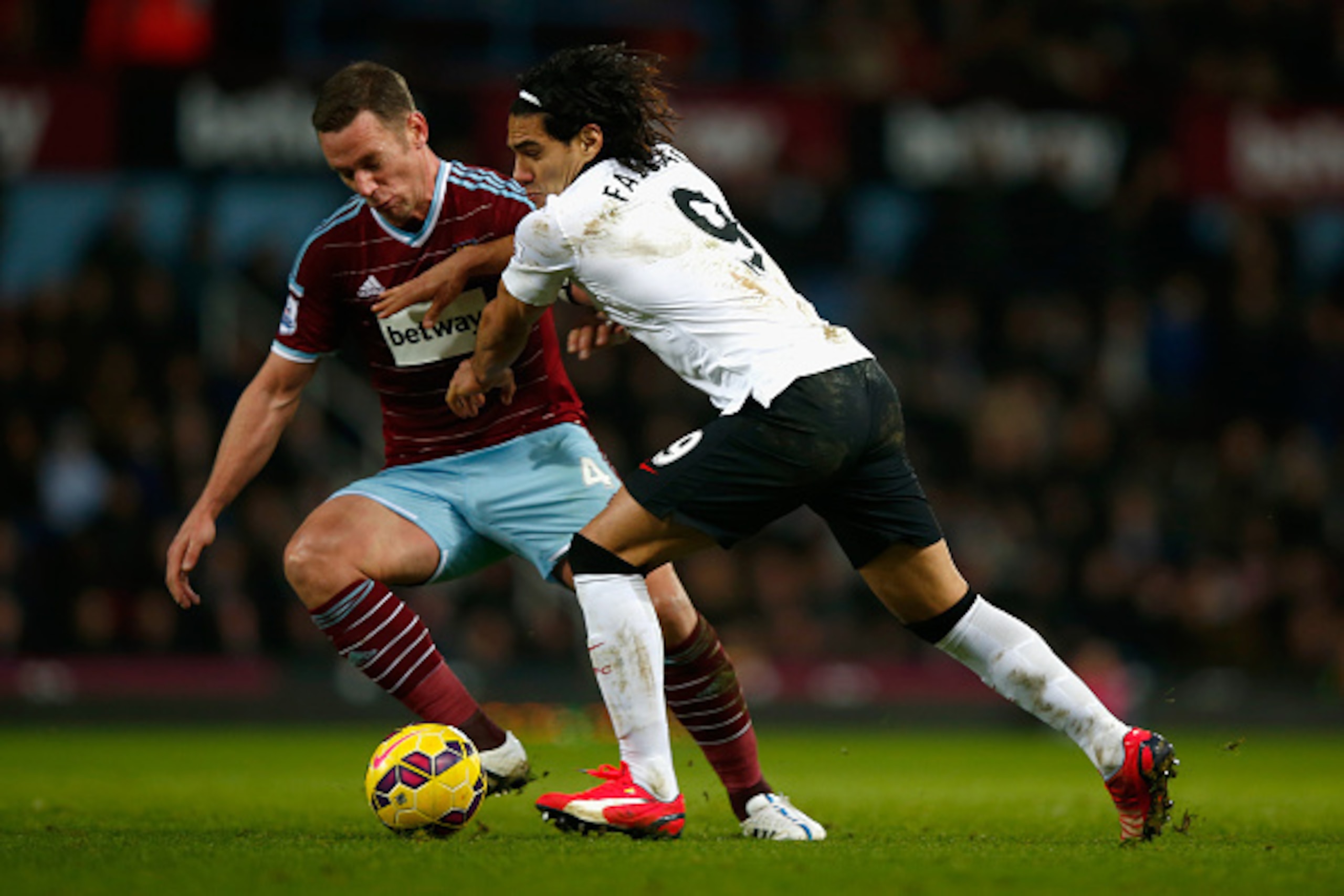LONDON, ENGLAND - FEBRUARY 08: Kevin Nolan of West Ham and Radamel Falcao Garcia of Manchester United battle for the ball during the Barclays Premier League match between West Ham United and Manchester United at Boleyn Ground on February 8, 2015 in Londo LONDON, ENGLAND - FEBRUARY 08: Kevin Nolan of West Ham and Radamel Falcao Garcia of Manchester United battle for the ball during the Barclays Premier League match between West Ham United and Manchester United at Boleyn Ground on February 8, 2015 in Londo