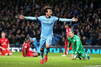 MANCHESTER, ENGLAND - MARCH 04:  David Silva of Manchester City celebrates after scoring the opening goal during the Barclays Premier League match between Manchester City and Leicester City at the Etihad Stadium on March 4, 2015 in Manchester, England.  (