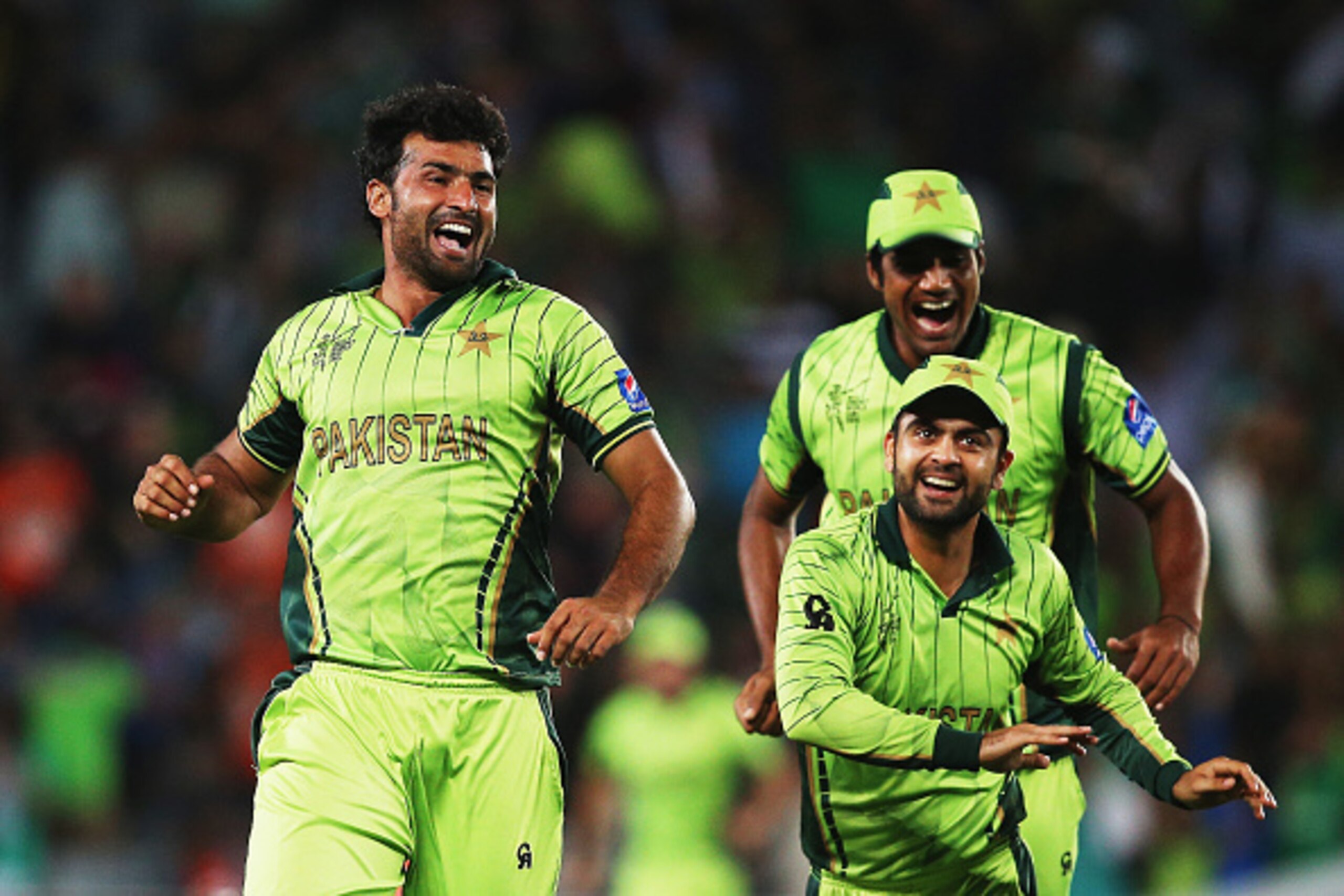 AUCKLAND, NEW ZEALAND - MARCH 07:  Sohail Khan of pakistan celebrates with Rahat Ali and Ahmad Shahzad of Pakistan after dismissing AB de Villiers of South Africa during the 2015 ICC Cricket World Cup match between South Africa and Pakistan at Eden Park o