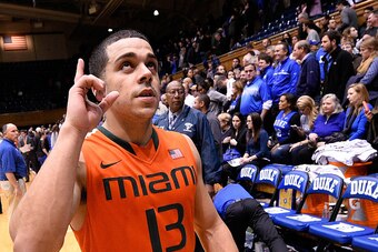 DURHAM, NC - JANUARY 13:  Angel Rodriguez #13 of the Miami Hurricanes reacts as he leaves the floor after a win against the Duke Blue Devils at Cameron Indoor Stadium on January 13, 2015 in Durham, North Carolina. Miami won 90-74.  (Photo by Grant Halvers
