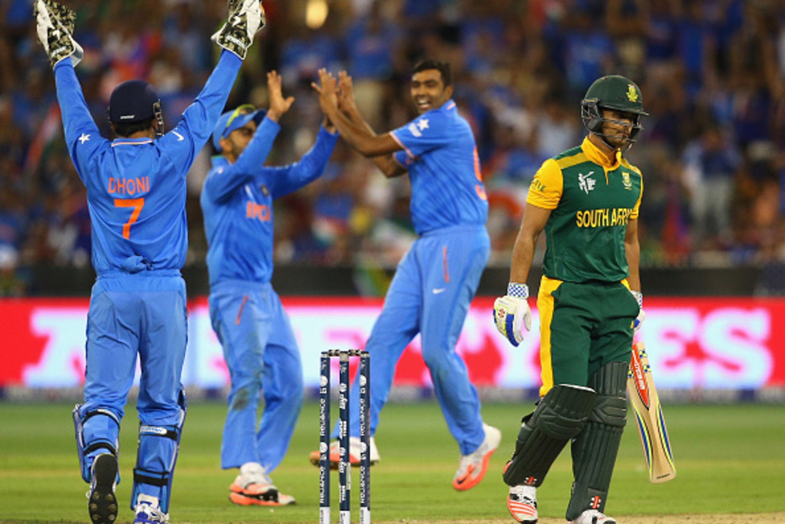 MELBOURNE, AUSTRALIA - FEBRUARY 22:  JP Duminy of South Africa leaves the field after being dismissed by Ravichandran Ashwin of India during the 2015 ICC Cricket World Cup match between South Africa and India at Melbourne Cricket Ground on February 22, 20