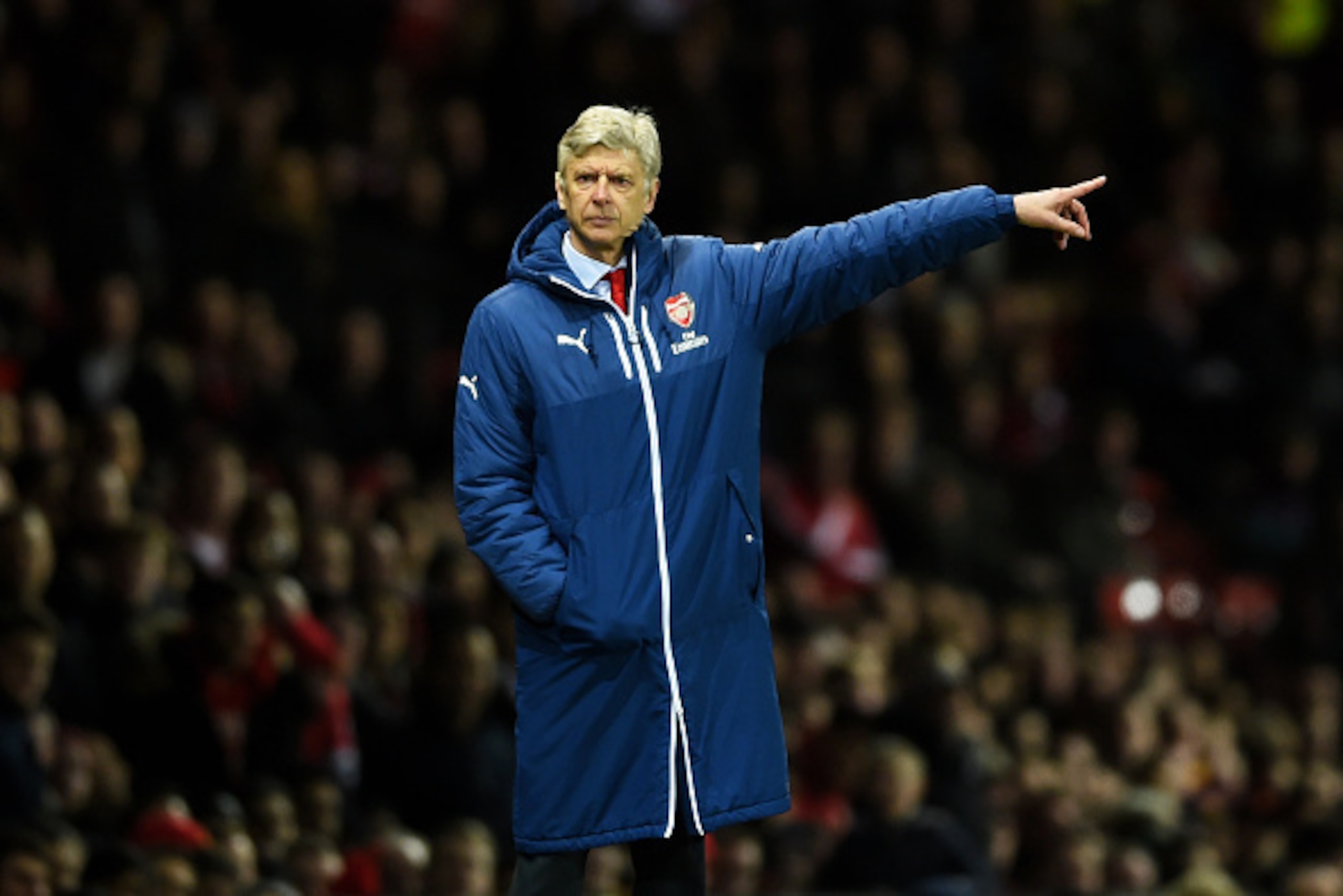 MANCHESTER, ENGLAND - MARCH 09:  Arsene Wenger the manager of Arsenal directs his players during the FA Cup Quarter Final match between Manchester United and Arsenal at Old Trafford on March 9, 2015 in Manchester, England.  (Photo by Laurence Griffiths/Ge