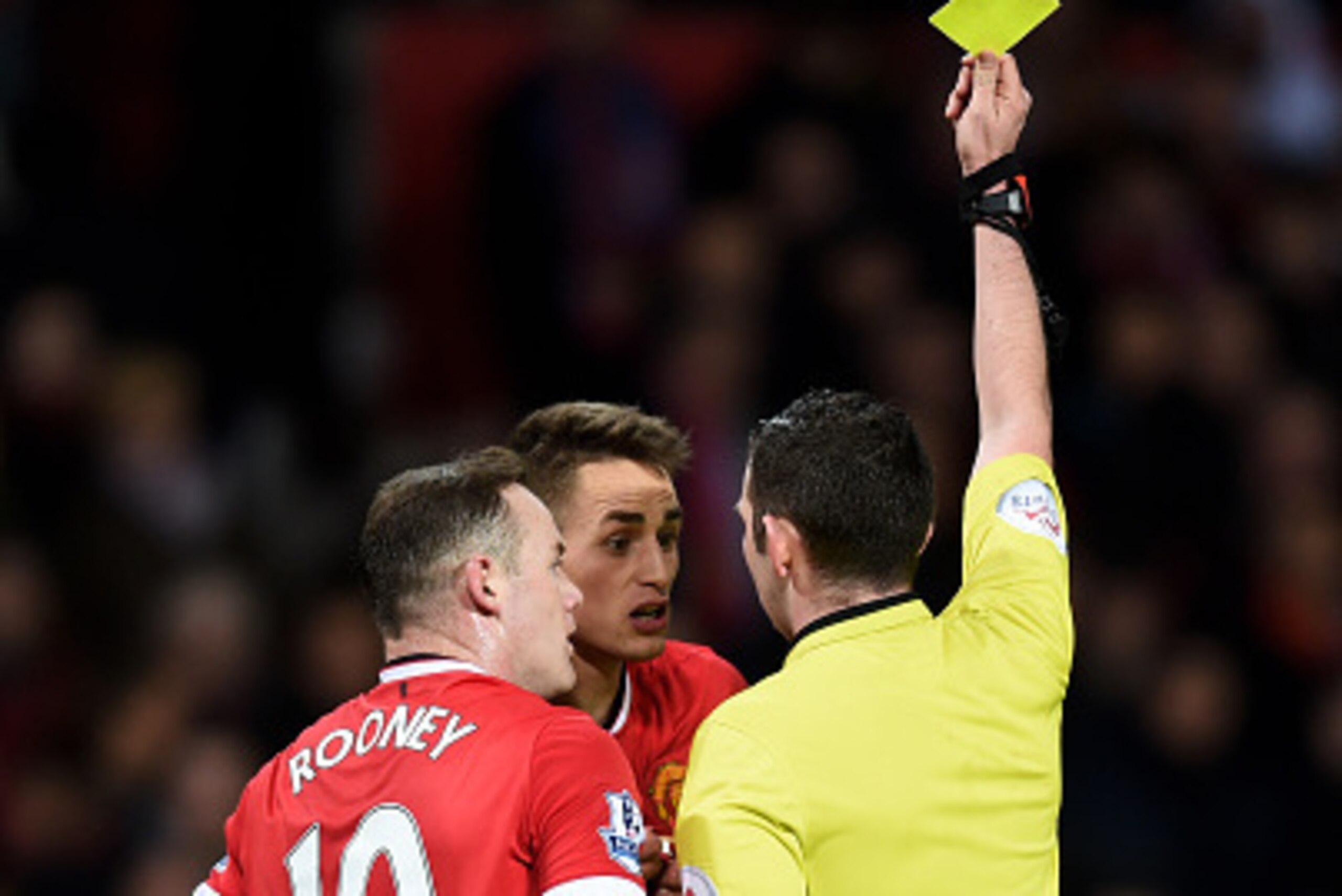 MANCHESTER, ENGLAND - MARCH 09: Refree Michael Oliver shows a yellow card to Adnan Januzaj of Manchester United for simulation during the FA Cup Quarter Final match between Manchester United and Arsenal at Old Trafford on March 9, 2015 in Manchester, Eng MANCHESTER, ENGLAND - MARCH 09: Refree Michael Oliver shows a yellow card to Adnan Januzaj of Manchester United for simulation during the FA Cup Quarter Final match between Manchester United and Arsenal at Old Trafford on March 9, 2015 in Manchester, Eng