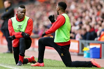 LIVERPOOL, ENGLAND - MARCH 01:  (L-R) Liverpool substitutes Mario Balotelli and Daniel Sturridge warm up during the Barclays Premier League match between Liverpool and Manchester City at Anfield on March 1, 2015 in Liverpool, England.  (Photo by Clive Bru