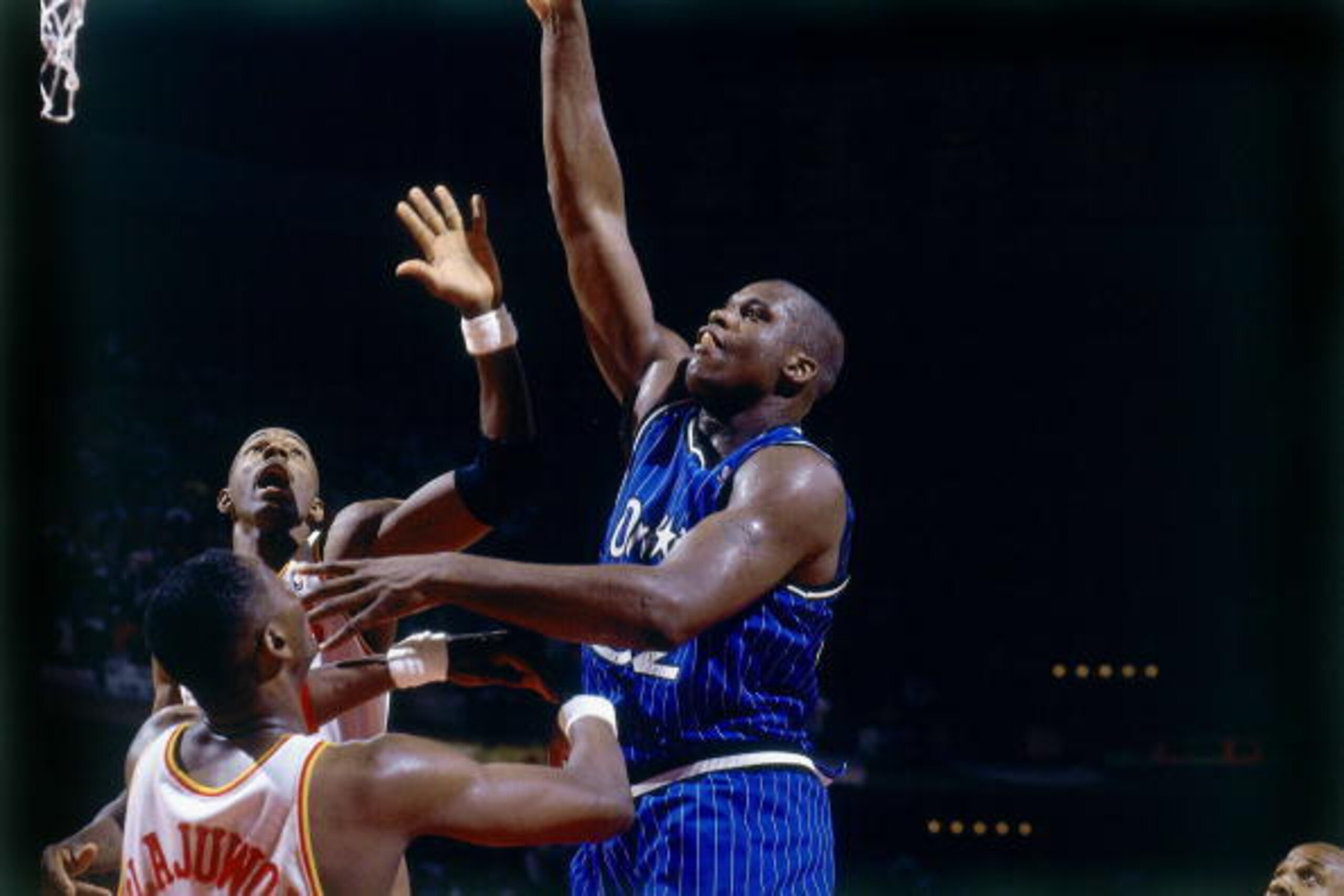 HOUSTON - JUNE 14:  Shaquille O'Neal #32 of the Orlando Magic attempts a shot against Hakeem Olajuwon #34 of the Houston Rockets in Game Four of the 1995 NBA Finals played June 14, 1995 at the Summit in Houston, Texas.  The Rockets won 113-101. NOTE TO US