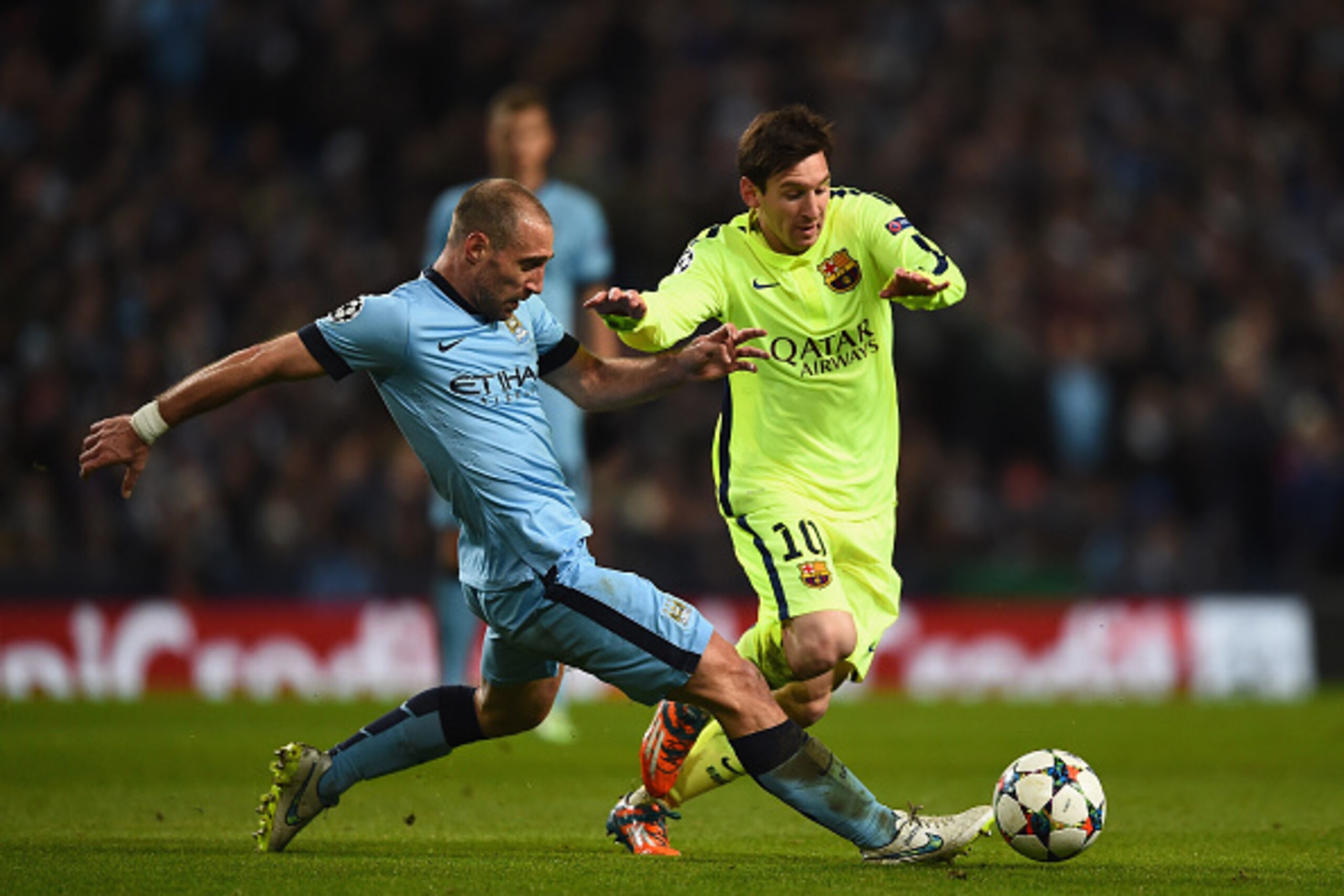 MANCHESTER, ENGLAND - FEBRUARY 24:  Pablo Zabaleta of Manchester City tackles Lionel Messi of Barcelona during the UEFA Champions League Round of 16 match between Manchester City and Barcelona at Etihad Stadium on February 24, 2015 in Manchester, United K