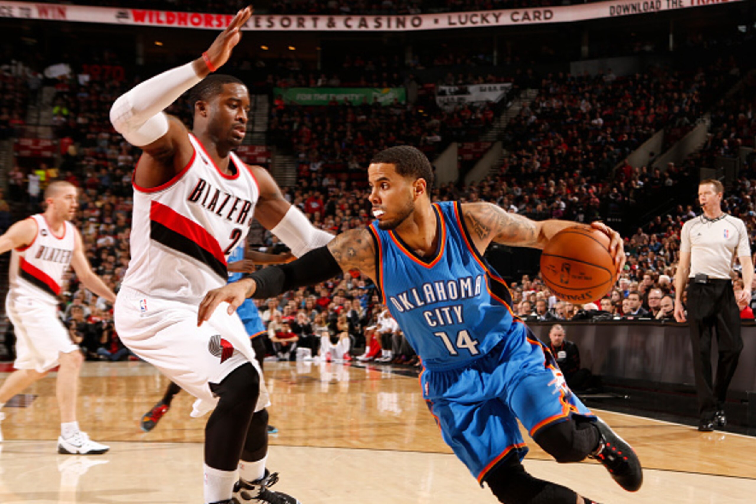 PORTLAND, OR -FEBRUARY 27: D.J. Augustin #14 of the Oklahoma City Thunder handles the ball against the Portland Trail Blazers on February 27, 2015 at the Moda Center Arena in Portland, Oregon. NOTE TO USER: User expressly acknowledges and agrees that, by 