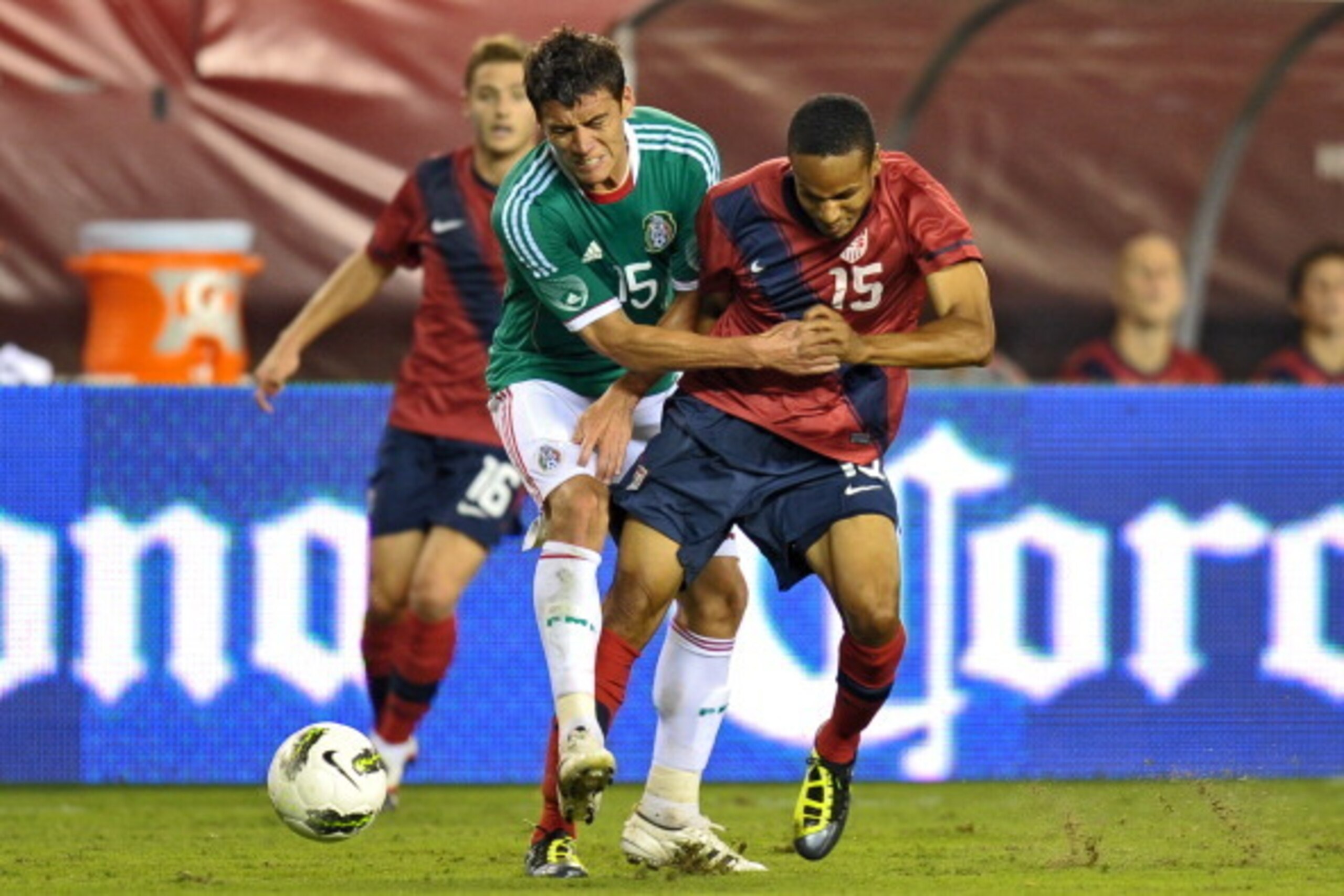 PHILADELPHIA, PA - AUGUST 10: Hector Moreno #15 of Mexico and Ricardo Clark #15 of the United States collide at Lincoln Financial Field on August 10, 2011 in Philadelphia, Pennsylvania. The game ended 1-1. (Photo by Drew Hallowell/Getty Images)