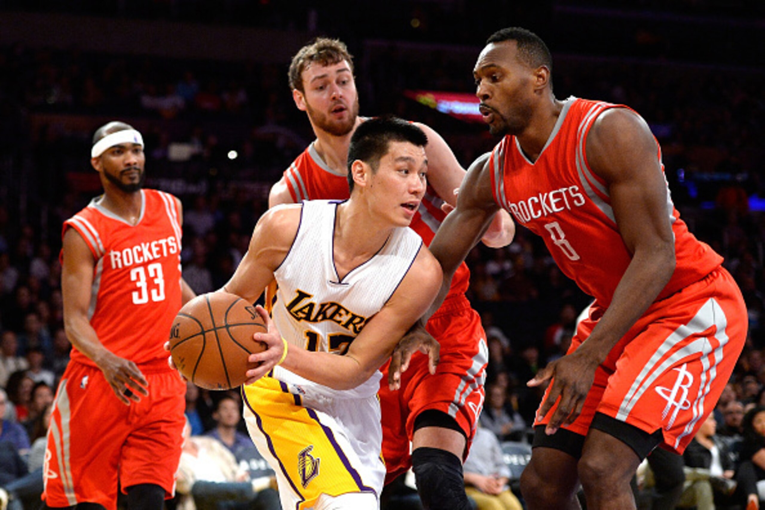 LOS ANGELES, CA - JANUARY 25: Jeremy Lin #17 of the Los Angeles Lakers makes a pass around Joey Dorsey #8 , Donatas Motiejunas #20, Corey Brewer #33 of the Houston Rockets during a 99-87 loss to the Rockets at Staples Center on January 25, 2015 in Los An LOS ANGELES, CA - JANUARY 25: Jeremy Lin #17 of the Los Angeles Lakers makes a pass around Joey Dorsey #8 , Donatas Motiejunas #20, Corey Brewer #33 of the Houston Rockets during a 99-87 loss to the Rockets at Staples Center on January 25, 2015 in Los An