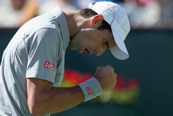 INDIAN WELLS, CA - MARCH 14:  Novak Djokovic of Serbia reacts after winning a point against Julien Benneteau of France during the BNP Paribas Open at Indian Wells Tennis Garden on March 14, 2014 in Indian Wells, California.  (Photo by Jeff Gross/Getty Ima