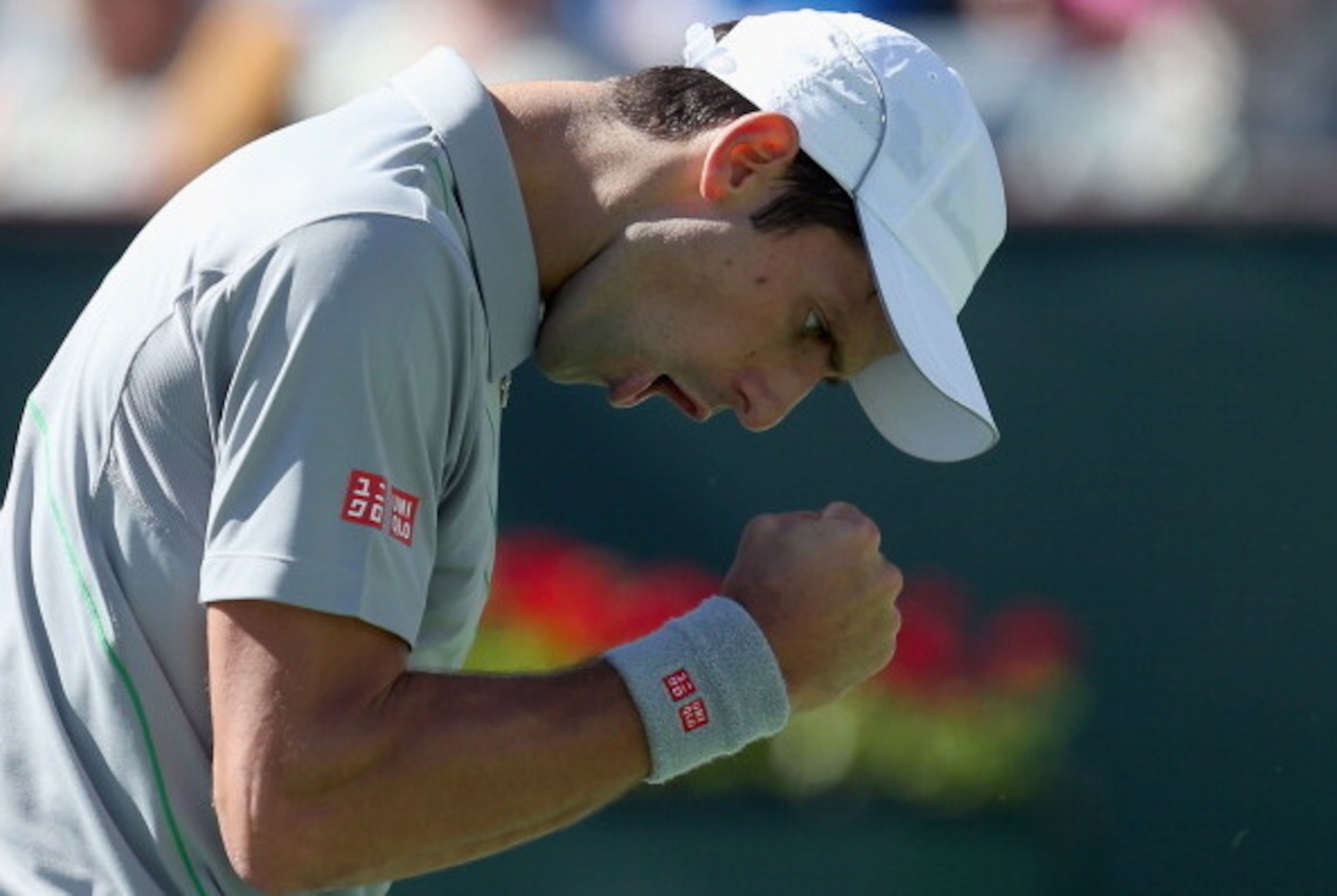 INDIAN WELLS, CA - MARCH 14:  Novak Djokovic of Serbia reacts after winning a point against Julien Benneteau of France during the BNP Paribas Open at Indian Wells Tennis Garden on March 14, 2014 in Indian Wells, California.  (Photo by Jeff Gross/Getty Ima