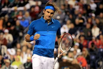 INDIAN WELLS, CA - MARCH 17: Roger Federer of Switzerland celebrates a point against Rafael Nadal of Spain during the semifinals of the BNP Paribas Open at the Indian Wells Tennis Garden on March 17, 2012 in Indian Wells, California.  (Photo by Matthew St