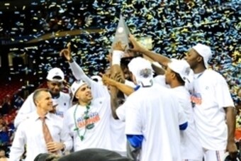 Mar 16, 2014; Atlanta, GA, USA; Florida Gators  players and head coach Billy Donovan celebrate after defeating the Kentucky Wildcats in the championship game for the SEC college basketball tournament at Georgia Dome. Florida defeated Kentucky 61-60. Manda