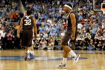 GREENSBORO, NC - MARCH 16:  (R) Mackey McKnight #11 of the Lehigh Mountain Hawks reacts late in the second half before the Mountain Hawks defeat the Duke Blue Devils 75-70 during the second round of the 2012 NCAA Men's Basketball Tournament at Greensboro 
