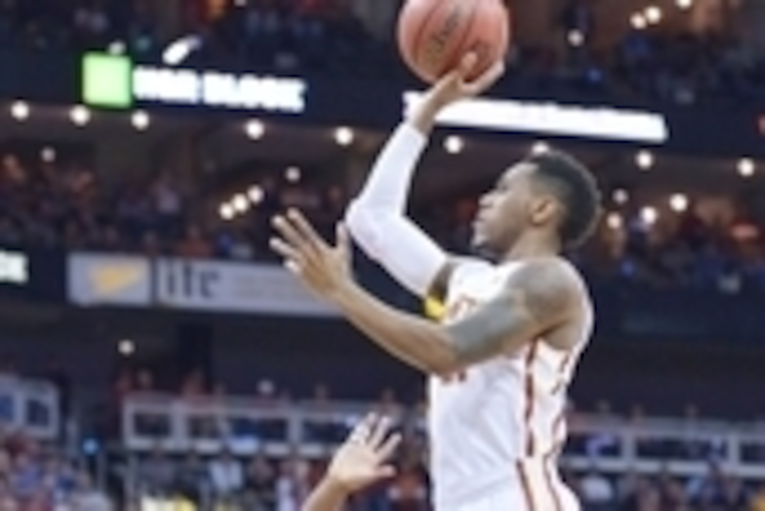 Mar 12, 2015; Kansas City, MO, USA; Iowa State Cyclones guard Monte Morris (11) shoots the ball as Texas Longhorns forward Myles Turner (52) defends during the first round at Sprint Center. Kansas won 64-59. Mandatory Credit: Denny Medley-USA TODAY Sports