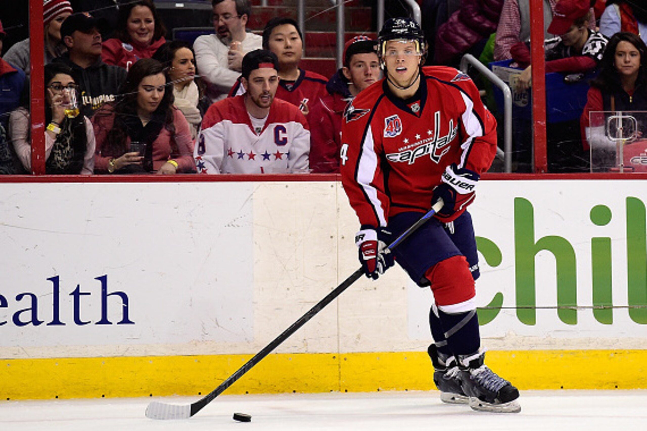 WASHINGTON, DC - FEBRUARY 08:  John Carlson #74 of the Washington Capitals controls the puck in the first period during an NHL game against the Philadelphia Flyers at Verizon Center on February 8, 2015 in Washington, DC.  (Photo by Patrick McDermott/NHLI 