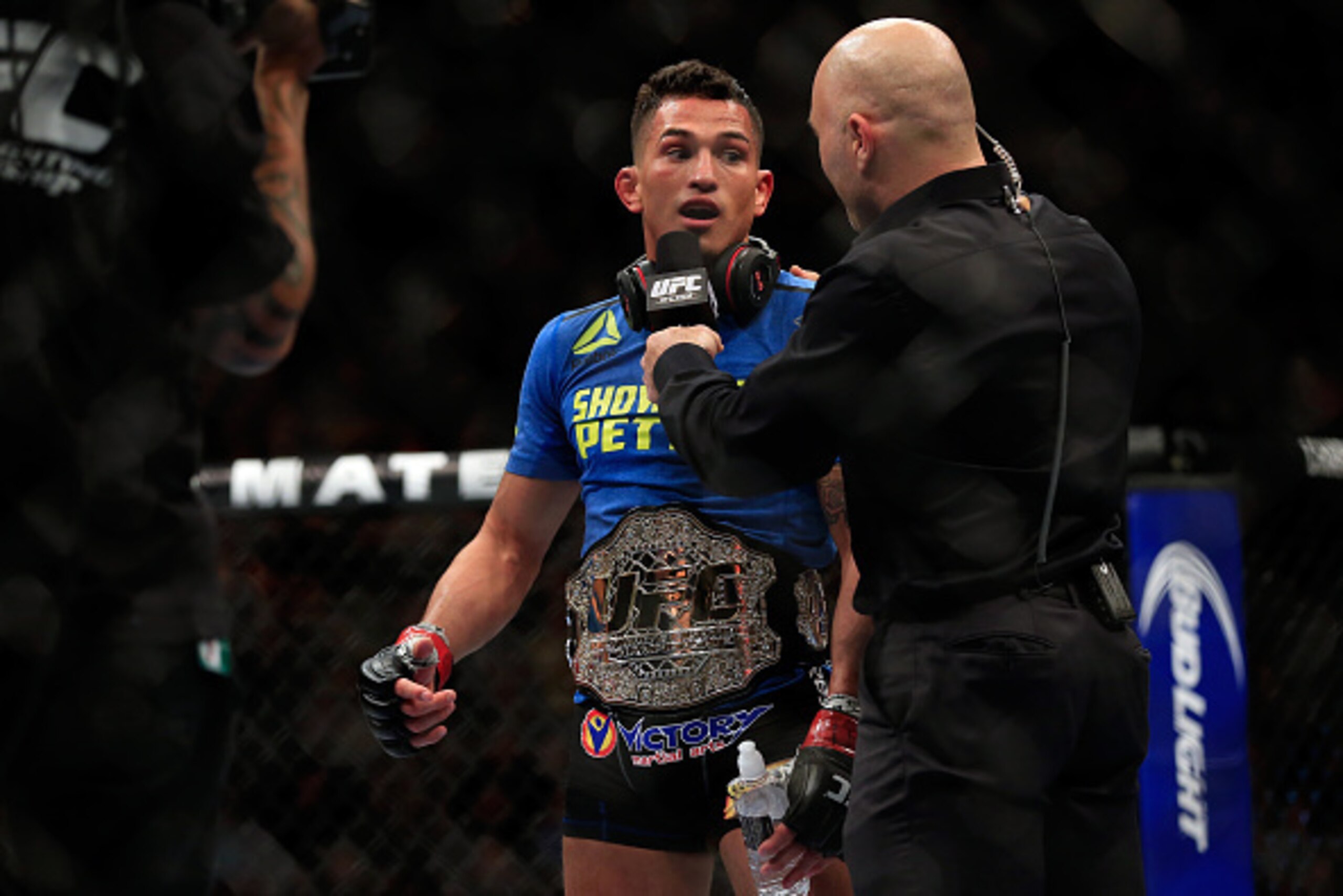 LAS VEGAS, NV - DECEMBER 06:  Anthony Pettis is interviewed by Joe Rogan after defeating Gilbert Menendez in their lightweight title fight during the UFC 181 event at the Mandalay Bay Events Center on December 6, 2014 in Las Vegas, Nevada.  (Photo by Alex