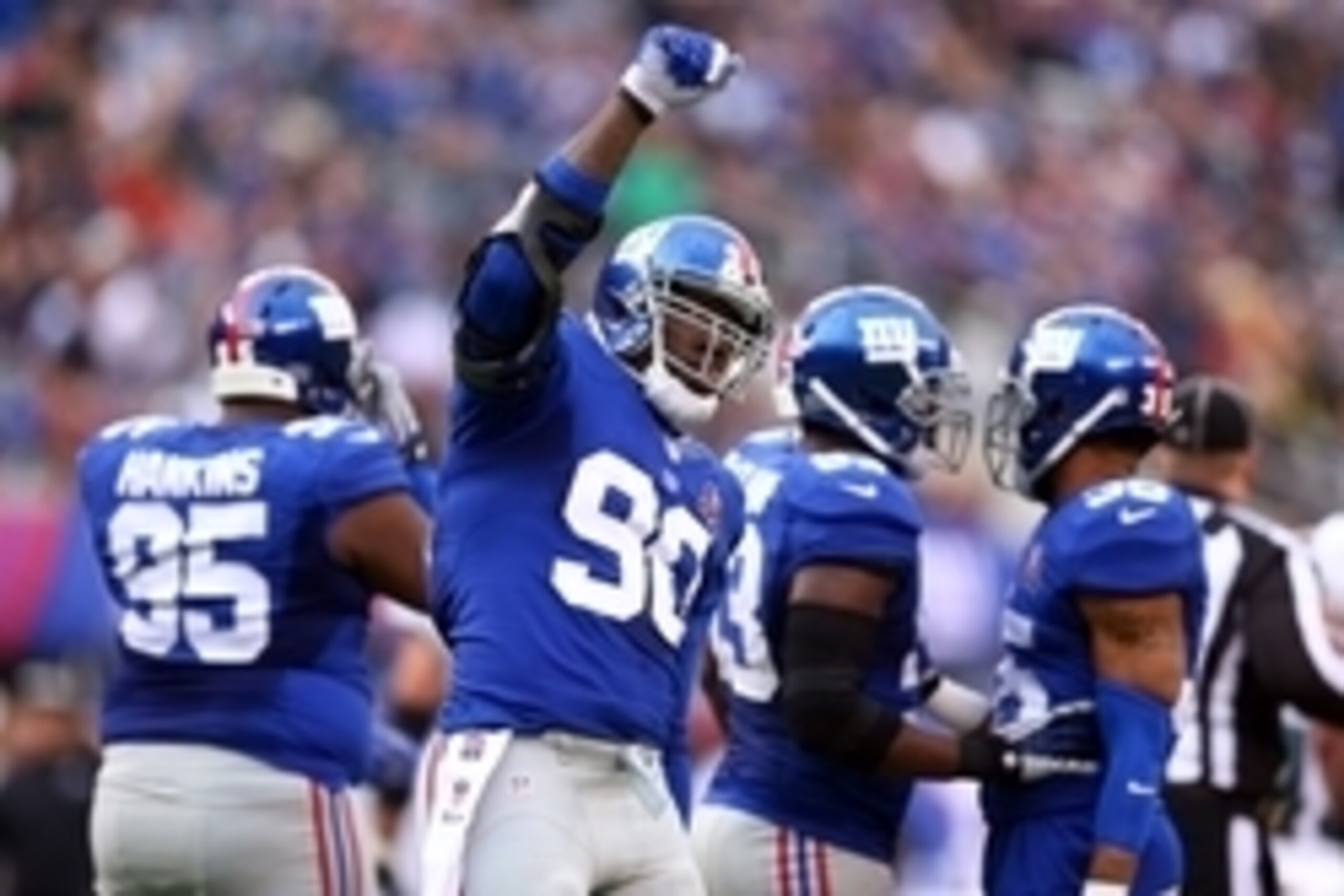Dec 28, 2014; East Rutherford, NJ, USA; New York Giants defensive end Jason Pierre-Paul (90) reacts against the Philadelphia Eagles during the second quarter at MetLife Stadium. Mandatory Credit: Brad Penner-USA TODAY Sports