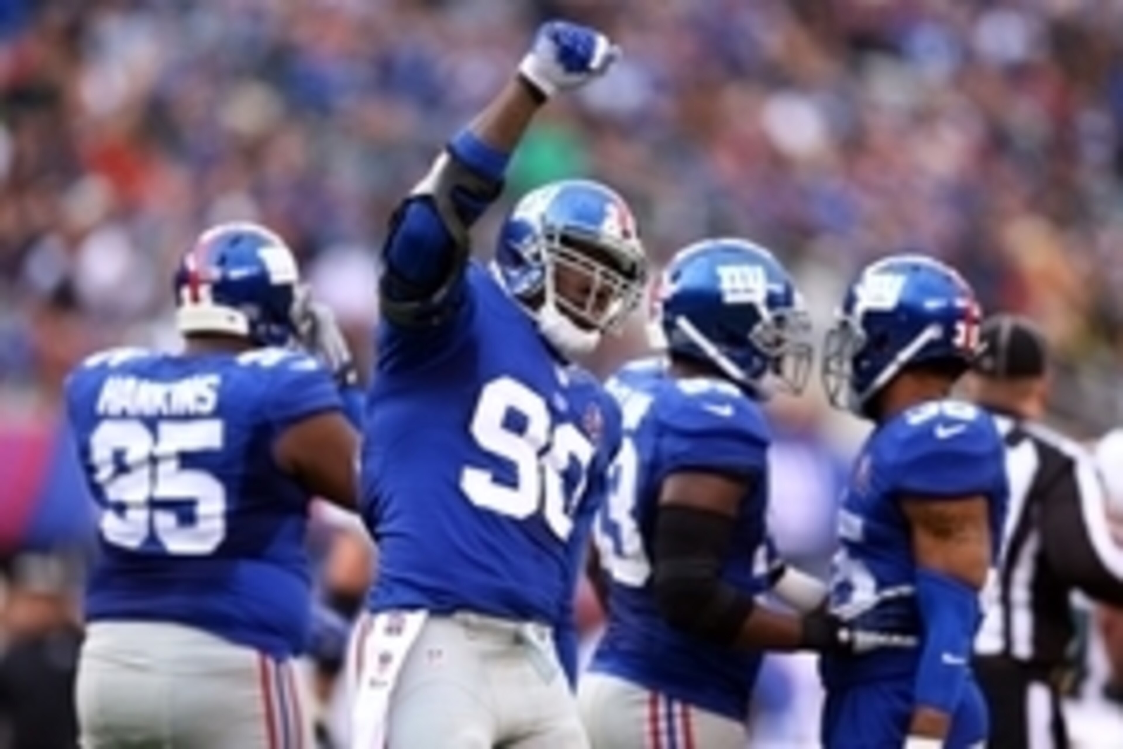 Dec 28, 2014; East Rutherford, NJ, USA; New York Giants defensive end Jason Pierre-Paul (90) reacts against the Philadelphia Eagles during the second quarter at MetLife Stadium. Mandatory Credit: Brad Penner-USA TODAY Sports