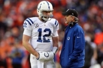 Jan 11, 2015; Denver, CO, USA; Indianapolis Colts quarterback Andrew Luck (12) talks with head coach Chuck Pagano during the second quarter in the 2014 AFC Divisional playoff football game at Sports Authority Field at Mile High. Mandatory Credit: Chris Hu