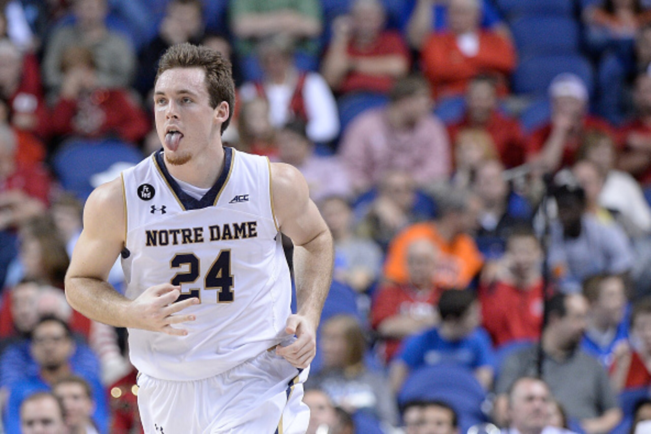 GREENSBORO, NC - MARCH 12:  Pat Connaughton #24 of the Notre Dame Fighting Irish reacts after making a three-point basket against the Miami Hurricanes during the quarterfinals of the ACC Basketball Tournament at Greensboro Coliseum on March 12, 2015 in Gr
