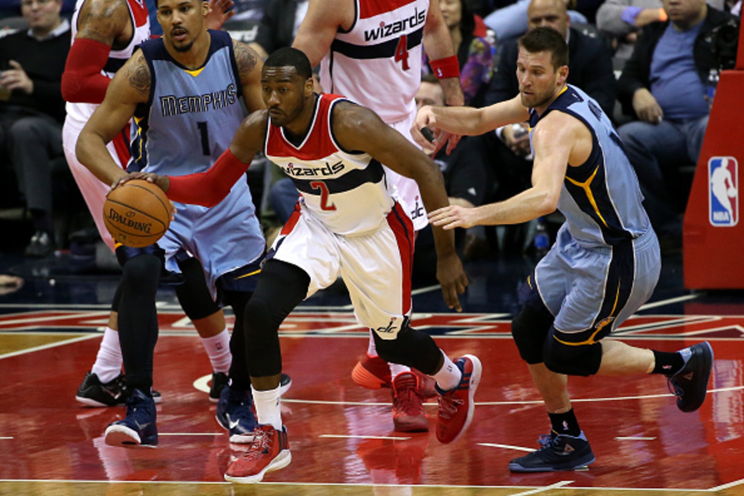 WASHINGTON, DC - MARCH 12: John Wall #2 of the Washington Wizards dribbles past Beno Udrih #19 of the Memphis Grizzlies in the second half at Verizon Center on March 12, 2015 in Washington, DC. NOTE TO USER: User expressly acknowledges and agrees that, by