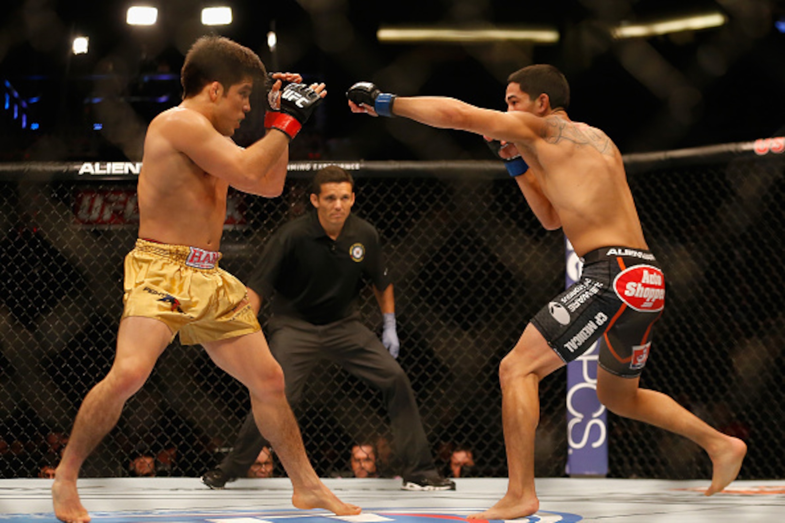 PHOENIX, AZ - DECEMBER 13:  (L-R) Henry Cejudo and Dustin Kimura fight during the UFC Fight Night event at the at U.S. Airways Center on December 13, 2014 in Phoenix, Arizona.  (Photo by Christian Petersen/Getty Images)