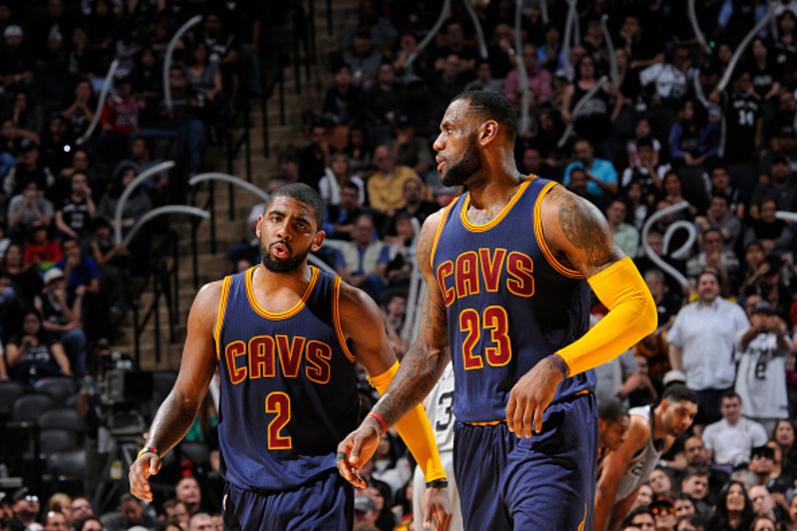 SAN ANTONIO - MARCH 12: Kyrie Irving #2 and LeBron James #23 of the Cleveland Cavaliers stand on the court during a game against the San Antonio Spurs at the AT&T Center on March 12, 2015 in San Antonio, Texas. NOTE TO USER: User expressly acknowledges an