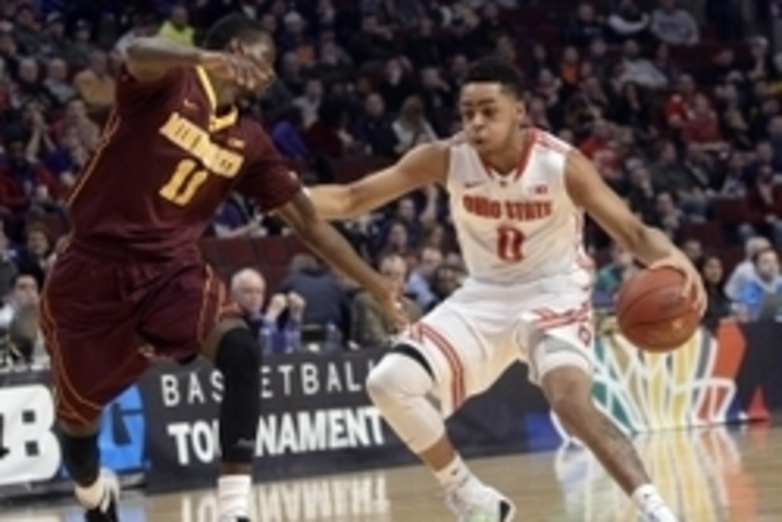 Mar 12, 2015; Chicago, IL, USA;  Ohio State Buckeyes guard D'Angelo Russell (0) is defended by Minnesota Golden Gophers guard Carlos Morris (11) during the first half in the second round of the Big Ten Conference Tournament at the United Center. Mandatory