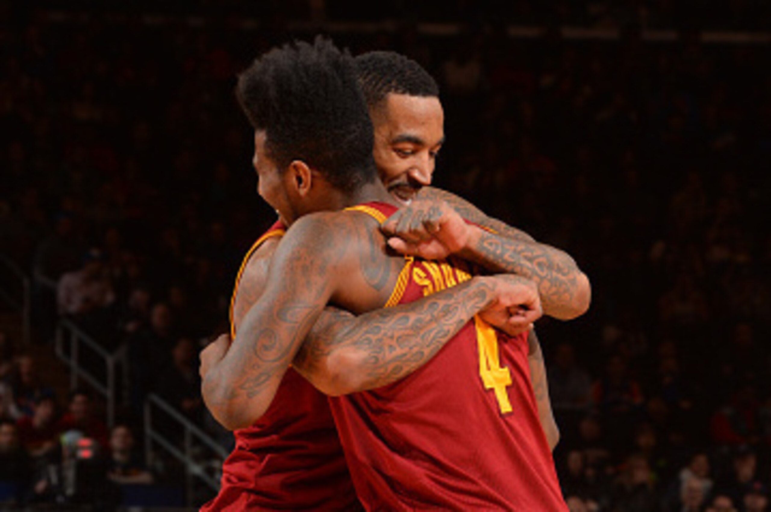 NEW YORK, NY - FEBRUARY 22:  J.R. Smith #5 and Iman Shumpert #4 of the Cleveland Cavilers share a moment after J.R. Smiths's reverse dunk against the New York Knicks on February 22, 2015 at Madison Square Garden in New York City.  NOTE TO USER: User expre