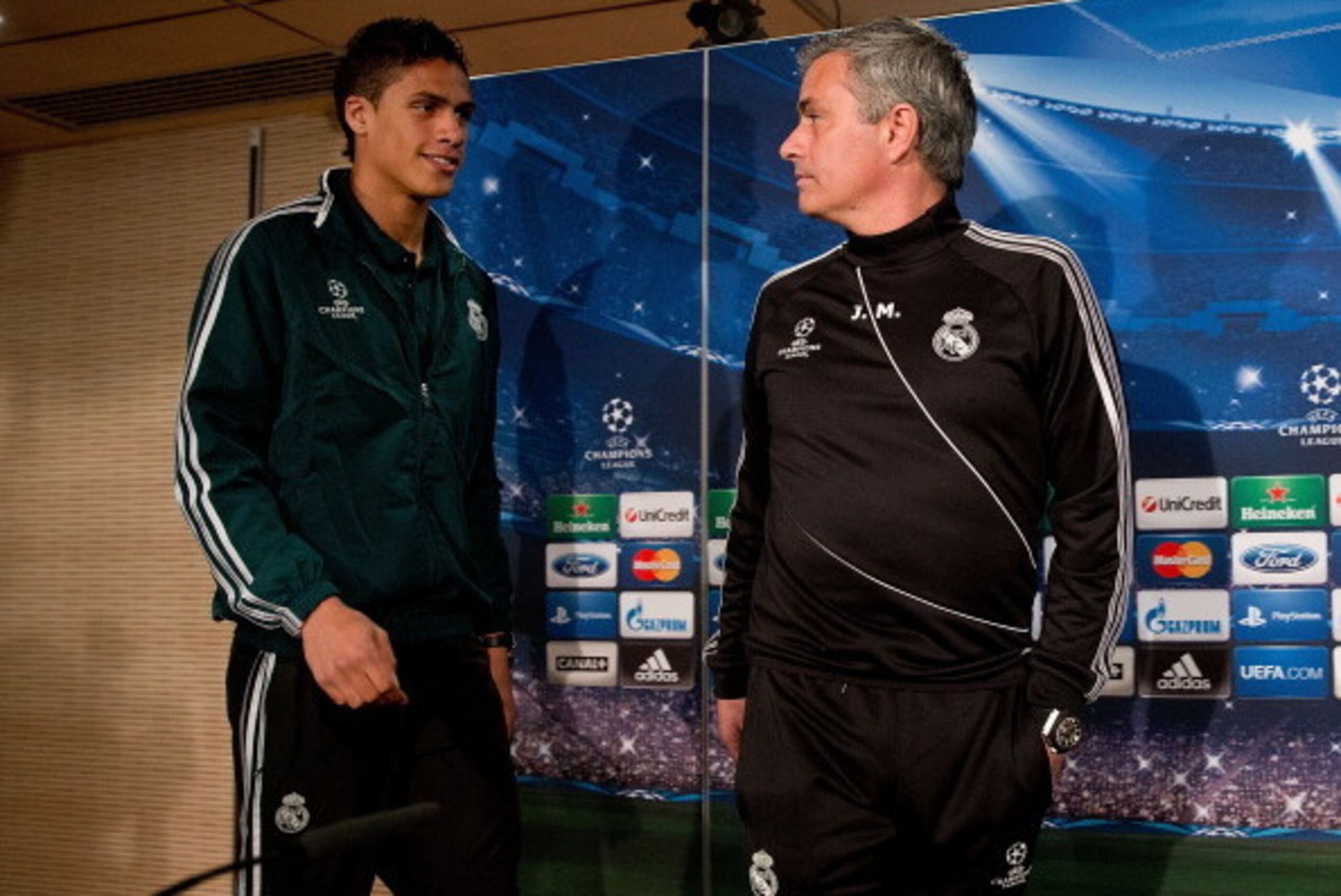 MADRID, SPAIN - APRIL 02:  Head coach Jose Mourinho (R) and Real madrid player Raphael varane prior to start a press conference ahead of the UEFA Champions League Quarterfinal match between Real Madrid and Galatasaray AS at Santiago Bernabeu Stadium on Ap